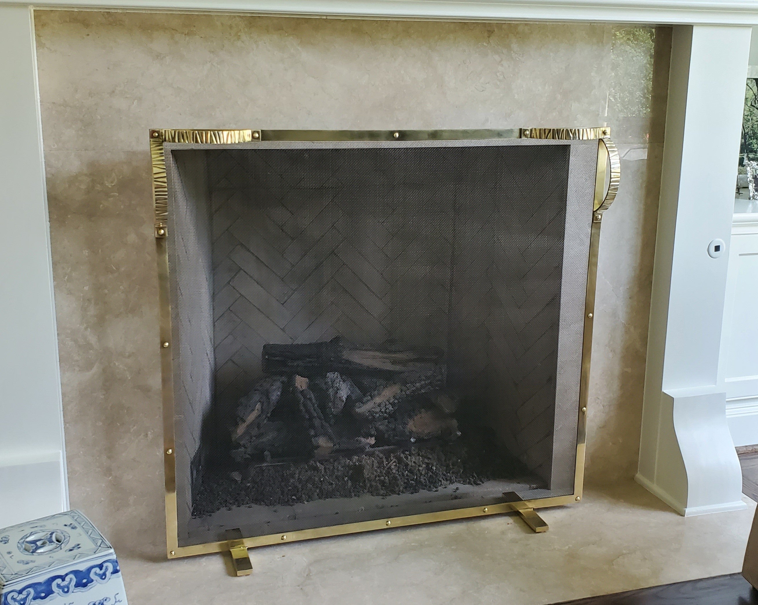 Here is our Olivia brass screen which is a perfect;y fabricated brass frame with our beautifully cast brass handles. This is available in polished and Lacquered, unlacquered brass, burnished brass and we can nickel plate this screen as well for a
