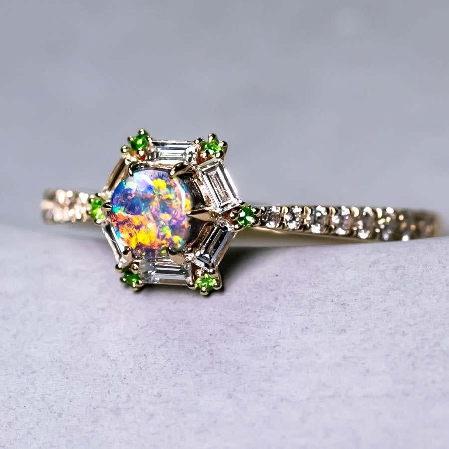 Design name: The One!
A truly one-of-kind designer ring for your forever one!

Design idea: A supreme hand-picked boulder opal surrounded by 6 sparkling baguette-cut diamonds and Tsavorite.  The 14 French pavé diamond accents maximize the fire and