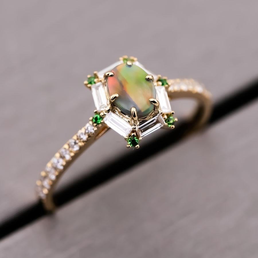 Bague de fiançailles en or jaune 18 carats : opale noire australienne, diamant taille baguette, tsavorite.



Nom du dessin ou modèle : The One !
Une bague de créateur unique en son genre pour l'être cher !

Idée de design : Une opale noire suprême