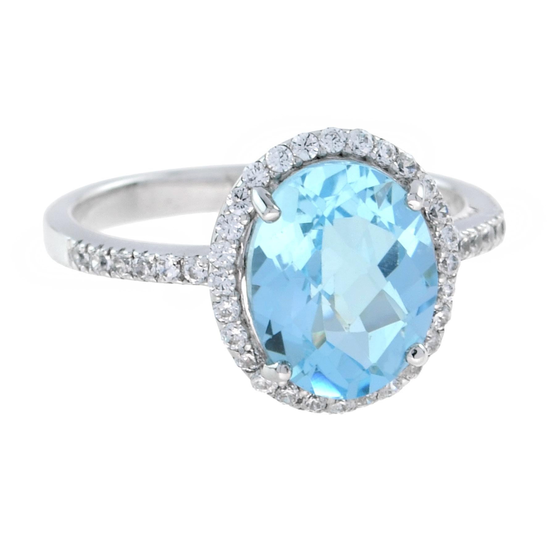 For Sale:  Classic Oval Blue Topaz with Diamond Engagement Ring in 18K White Gold 4