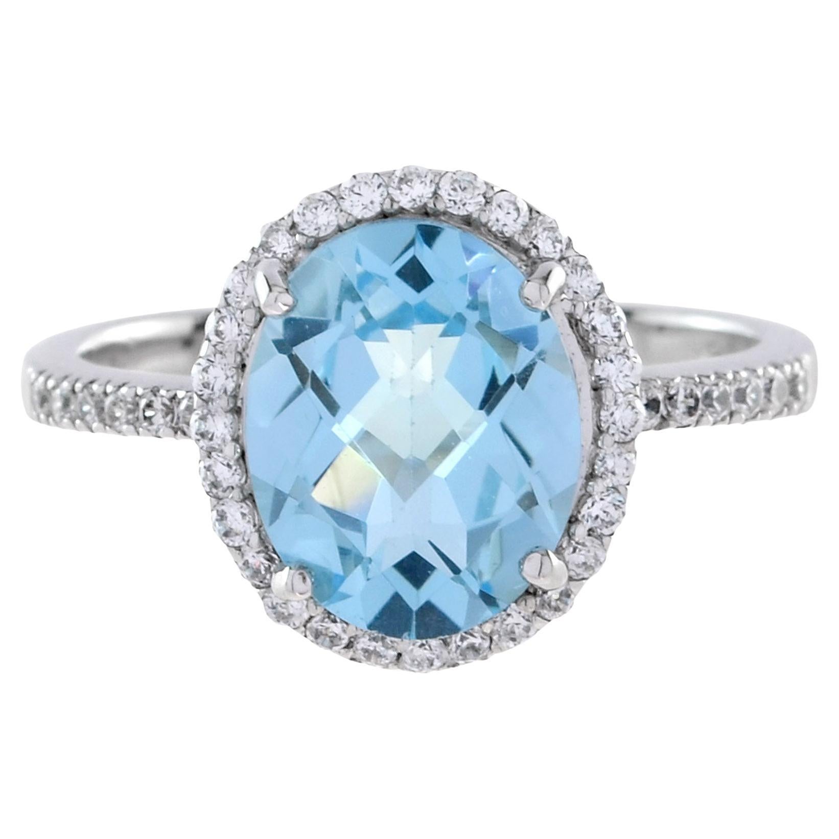 En vente :  Bague de fiançailles classique en or blanc 18 carats avec topaze bleue ovale et diamants