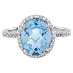 Classic Oval Blue Topaz with Diamond Engagement Ring in 18K White Gold