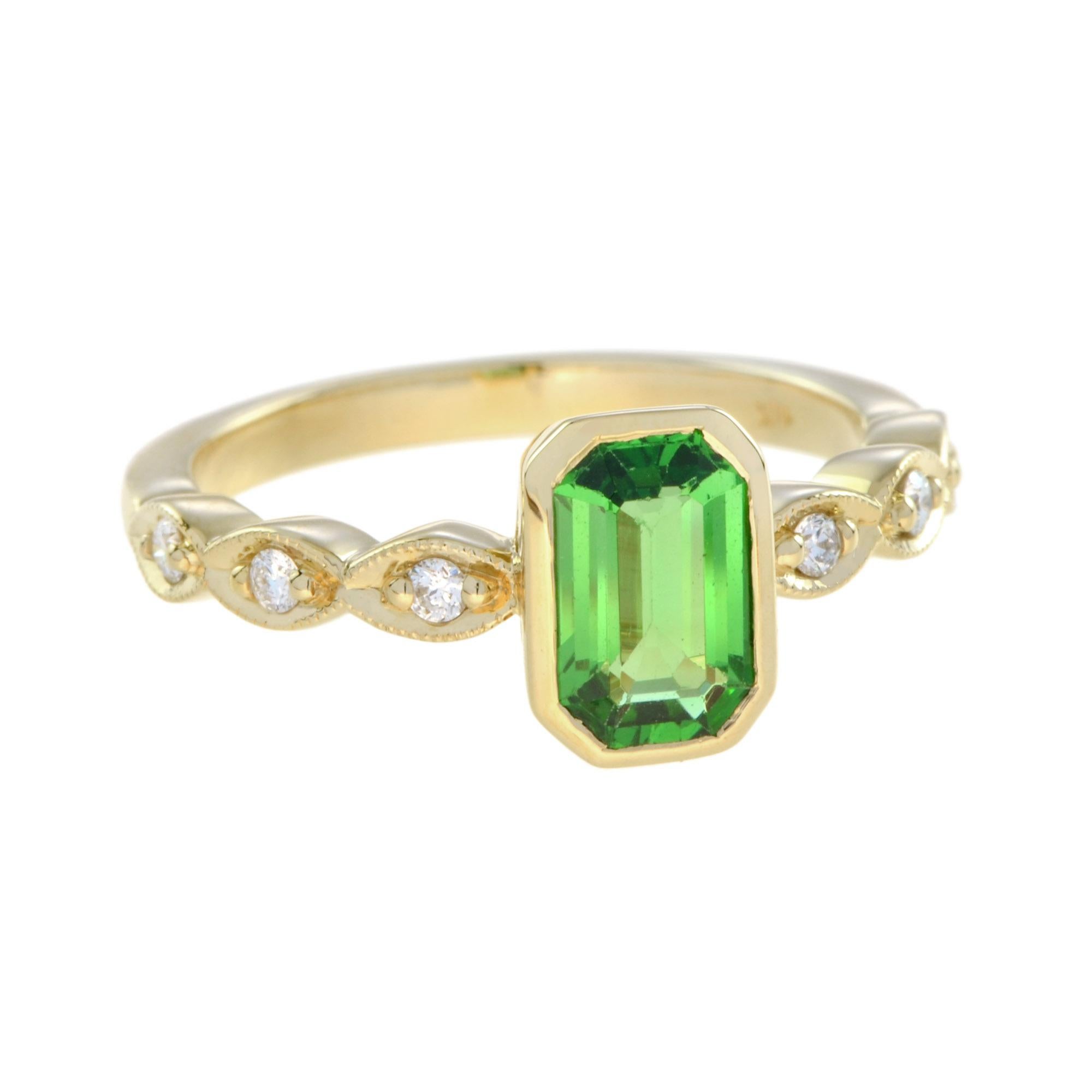 This gorgeous pretty ring is beautifully set with an emerald cut natural tsavorite and round diamonds on shoulders. The intense green color tsavorite  is in bezel setting. The diamonds each set into an elongated marquise create a unique detailing to