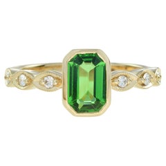 The One Emerald Cut Tsavorite and Diamond Engagement Ring in 18K Yellow Gold