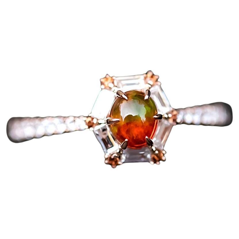 The One - Rare Two Tones Mexican Fire Opal, Baguette Cut Diamond, Sapphire Engagement Ring 18K Rose Gold.

Design name: The One!
A truly one-of-a-kind designer ring for your forever one!

Design idea: A supreme hand-picked fire opal that is