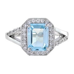 Emerald Cut Aquamarine and Diamond Split Shank Halo Ring in 18K White Gold