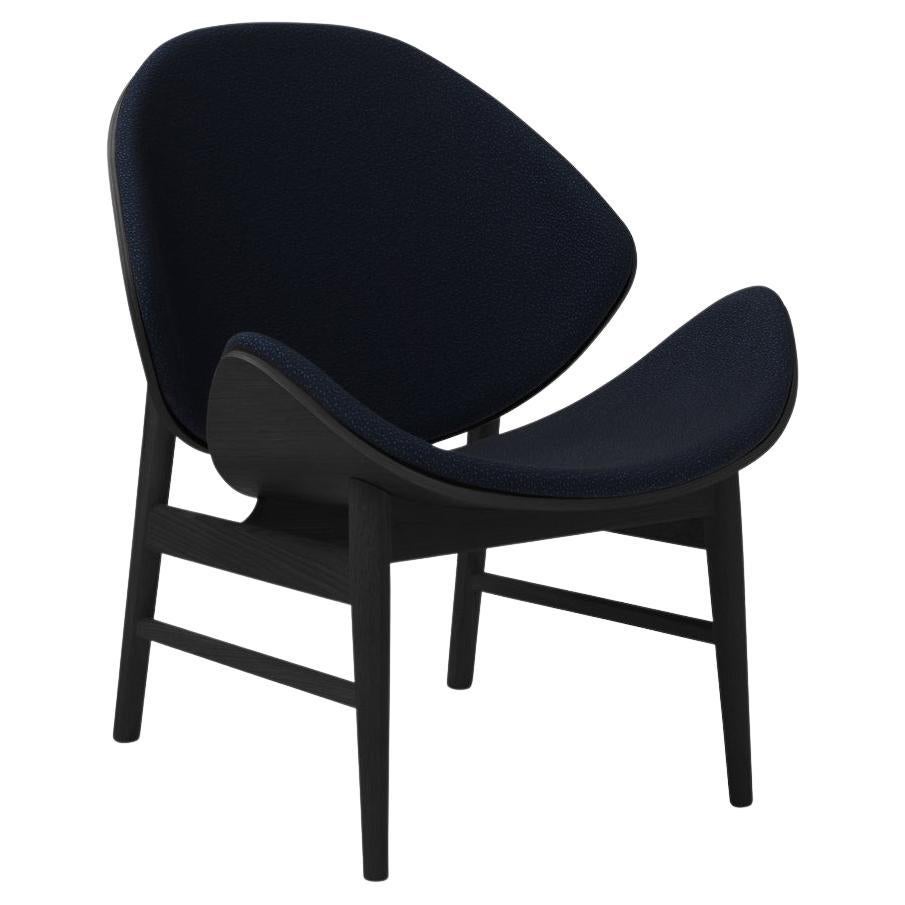 La chaise Orange Sprinkles en chêne laqué noir Midnight Blue de Warm Nordic