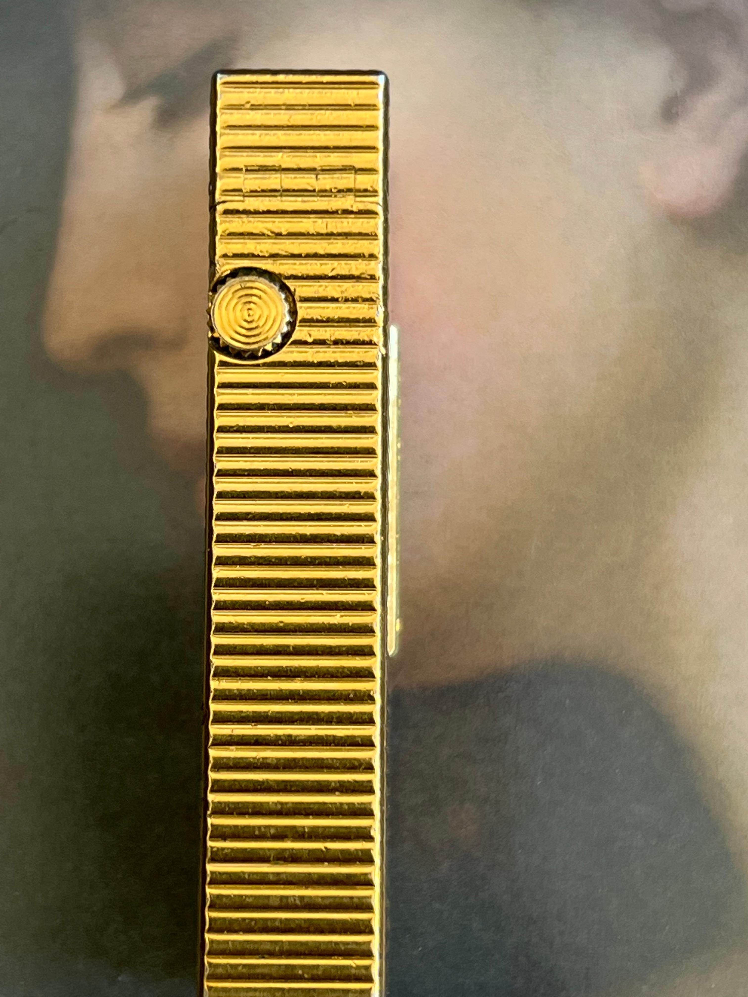 The original “James Bond” rare & Iconic Vintage Dunhill Gold Swiss Lighter 1