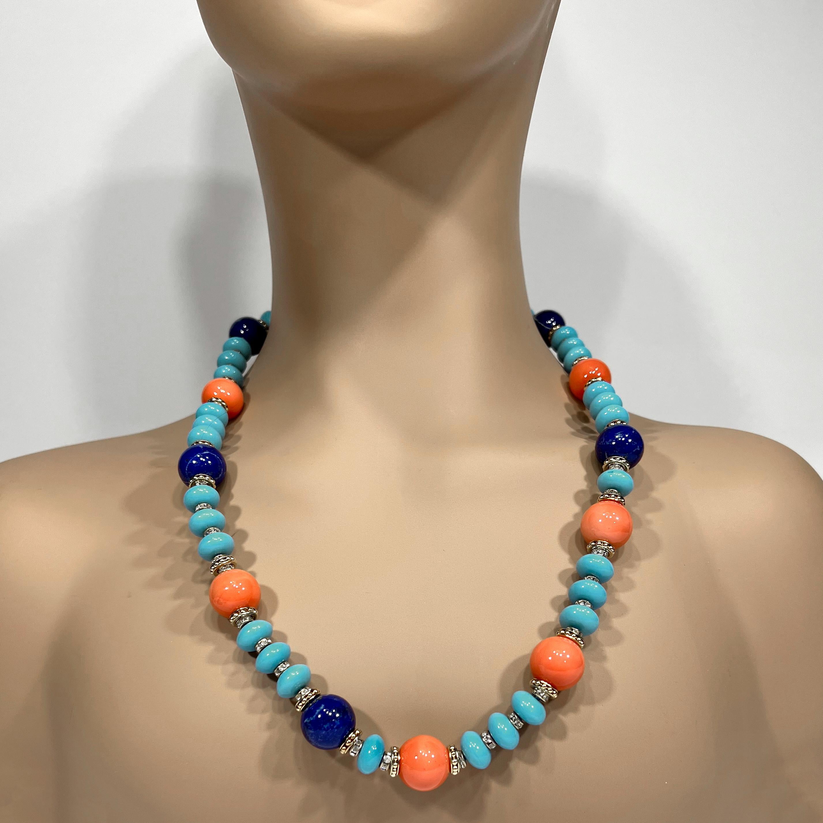 From our Palm Beach Look collection, an elegant strand of man-made 16mm coral, turquoise, lapis-lazuli beads interspersed with gilt and diamante set rondels made to a 25 inch length attached to an easy gilt clasp.  Perfect for layering with similar,