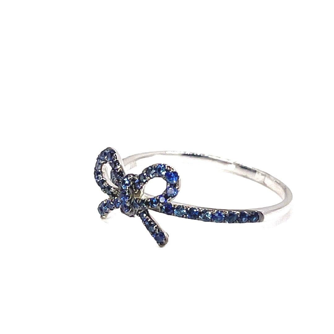 Round Cut The Papillan Sapphire Bow Ring in White Gold For Sale