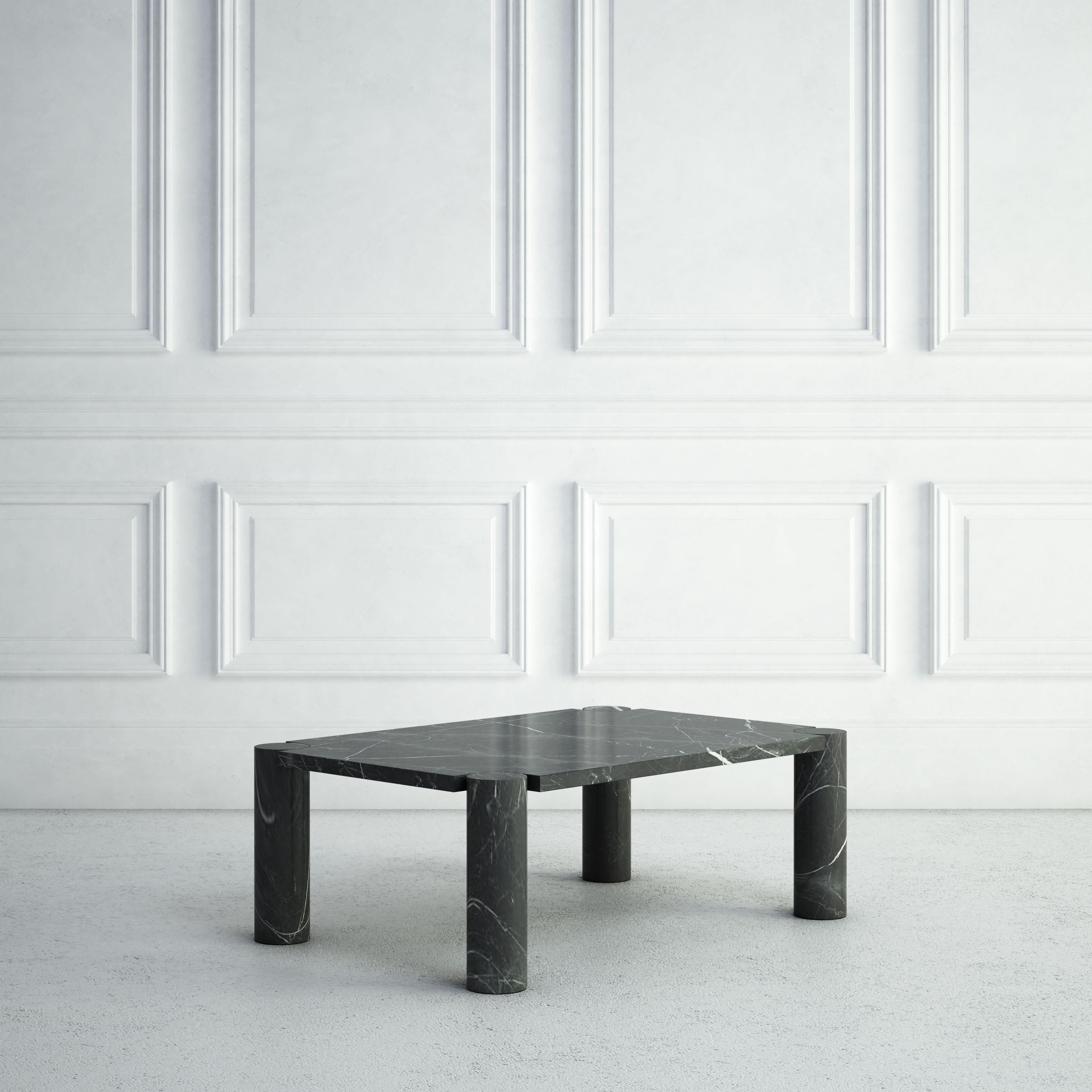 The Pauline is a traditional stone coffee table with a twist:  its 4 legs are all perfectly-turned cylinders. The 4 stone legs support a slim rectangular stone top that notches around the tops of the legs.  The same stone is used throughout.   The