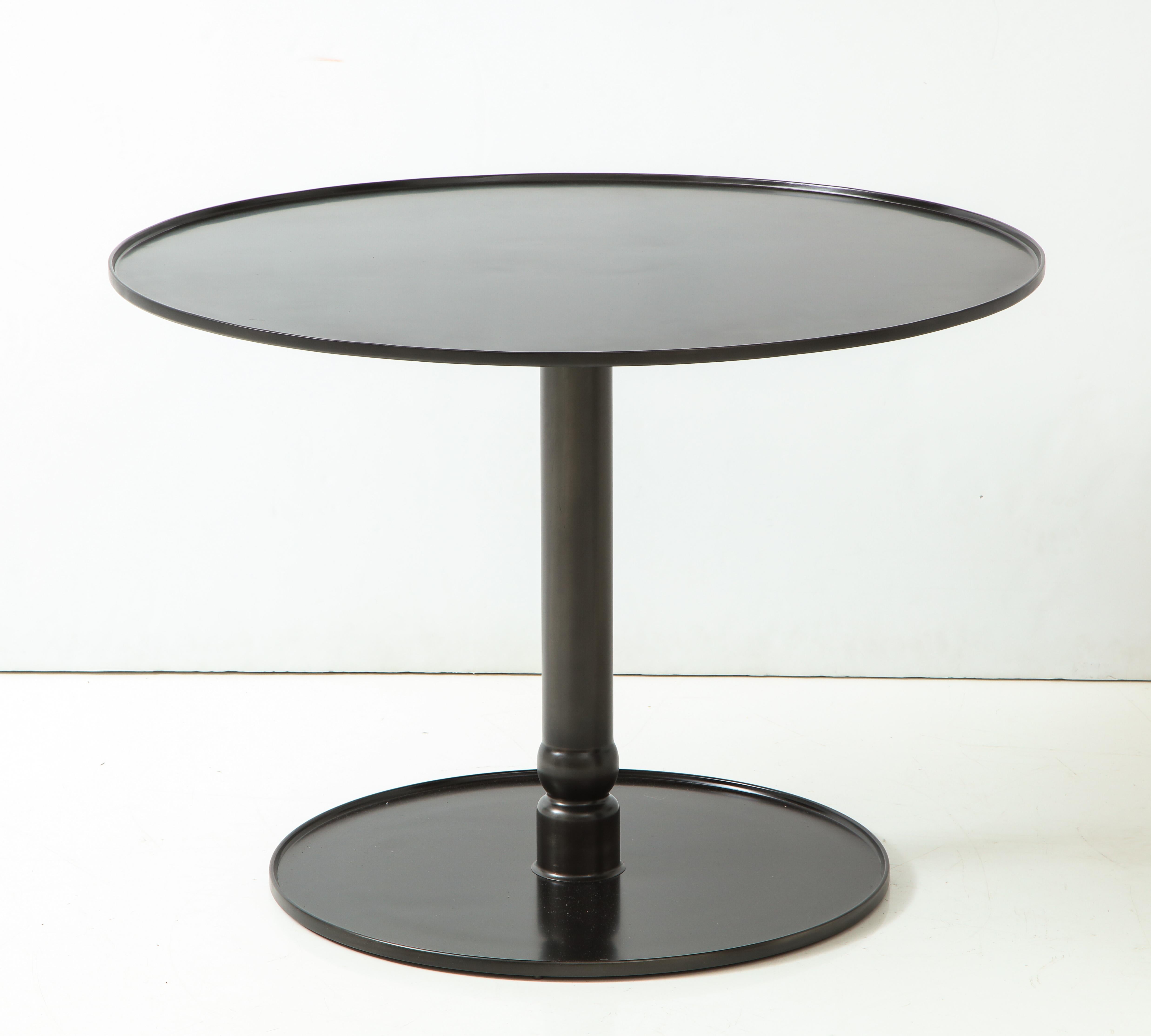 Pedestal Steel Table”, Hand Blackened Patina with Cast Base and Forged Edges.

Made to Order. Standard Finish: Hand-rubbed Wax

Custom Sizes, Finish, and Materials

Leather Top Insert Optional

H: 27 Diam. 37.75 inches ONE IN STOCK

Lead