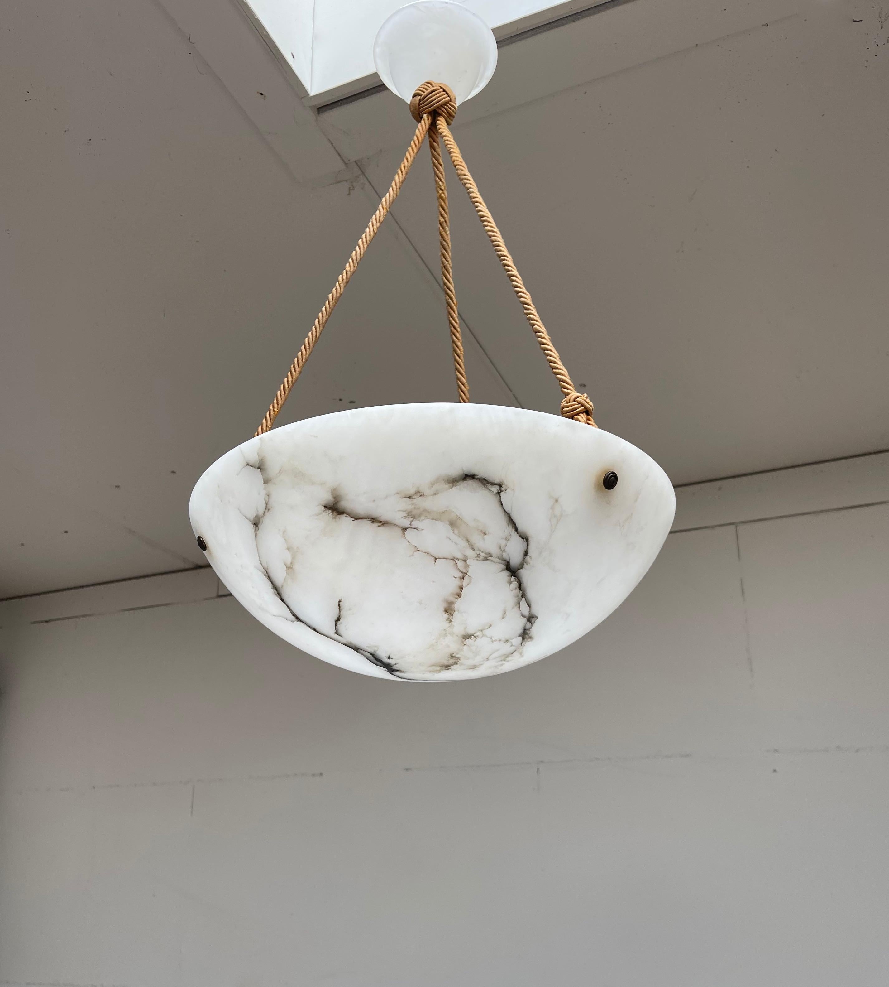Good size black and white alabaster chandelier with original rope and alabaster canopy.

This superb condition Art Deco pendant is another one of our recent great finds. Every piece, from the alabaster canopy down to the excellent shape shade is