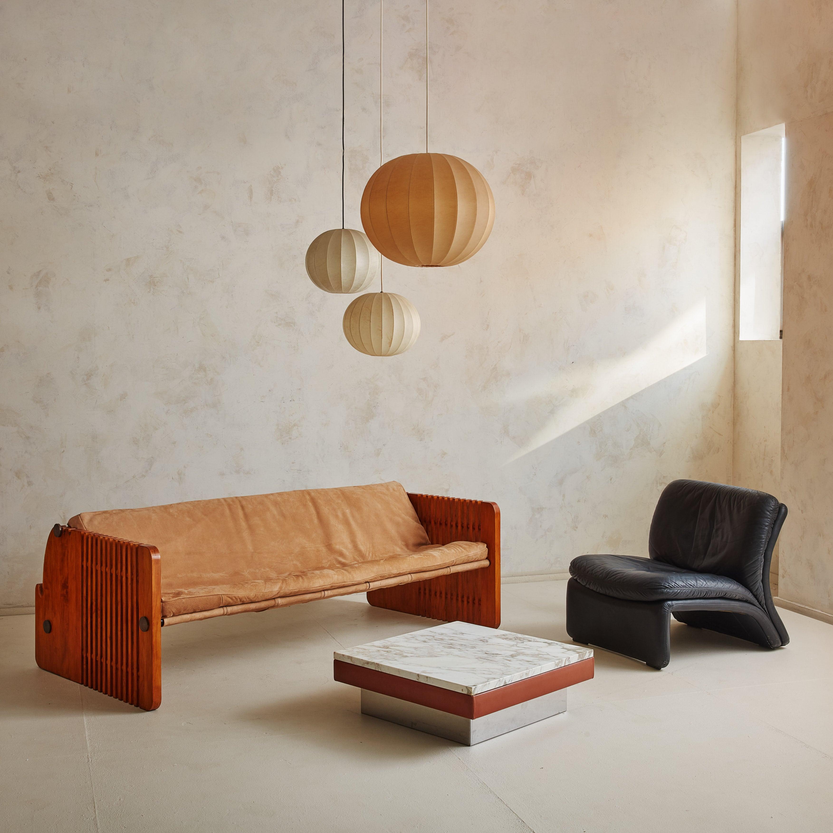 The 'Porcellino' sofa translated 'Piglet' was designed by Florence Architect Marzio Cecchi for Studio Most in the 1970s.  Known for his sculptural approach to furniture design, this model has the original buttery suede and easily transforms from a