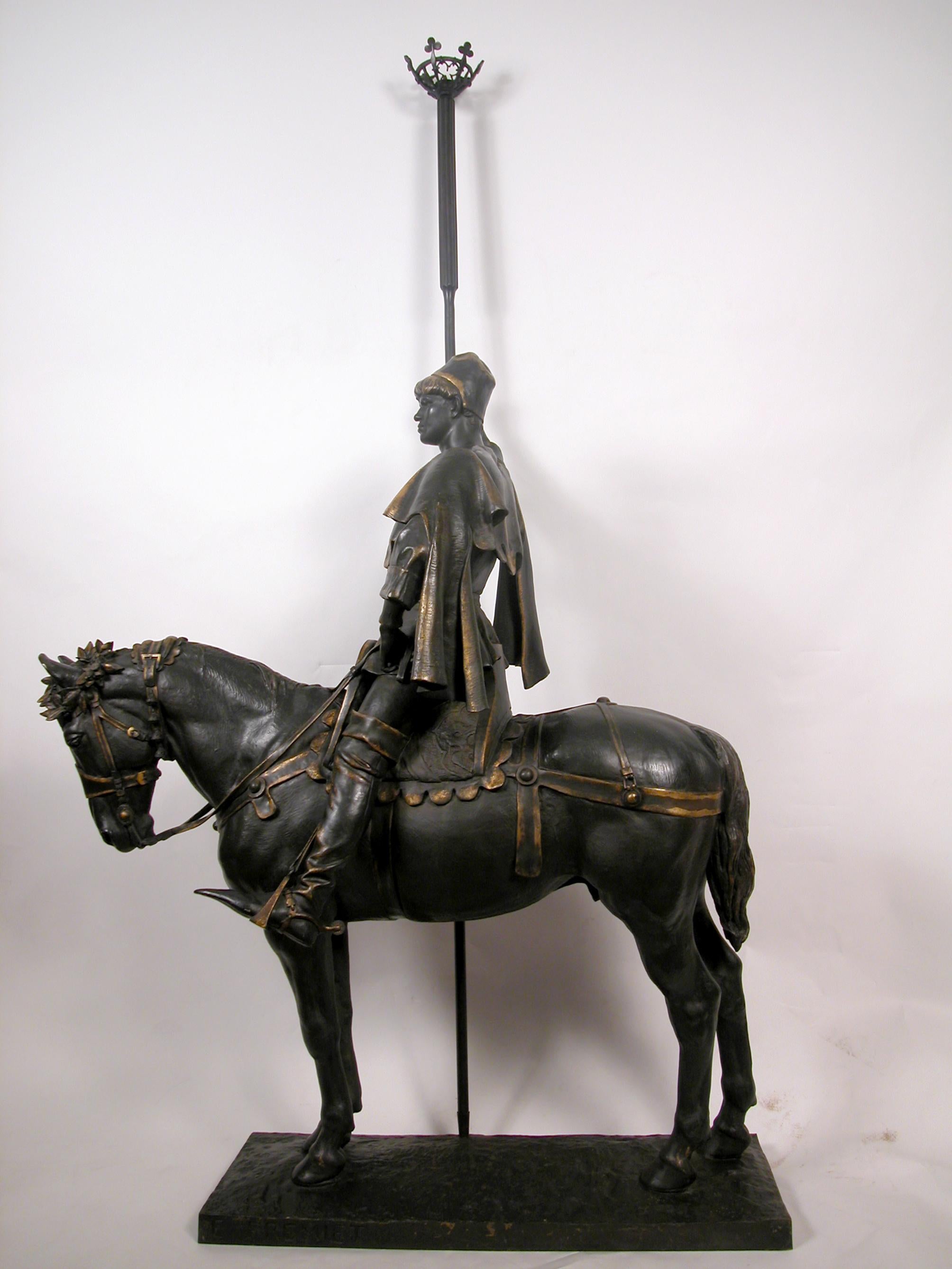 Signed E. Frémiet and F. Barbedienne, Fondeur.

This two patina bronze is listed as the Porte-falot (Torch-holder) model No. 1. It is two thirds lower cast of the equestrian group ordered in 1882 by the Prefecture of the Seine to serve as a