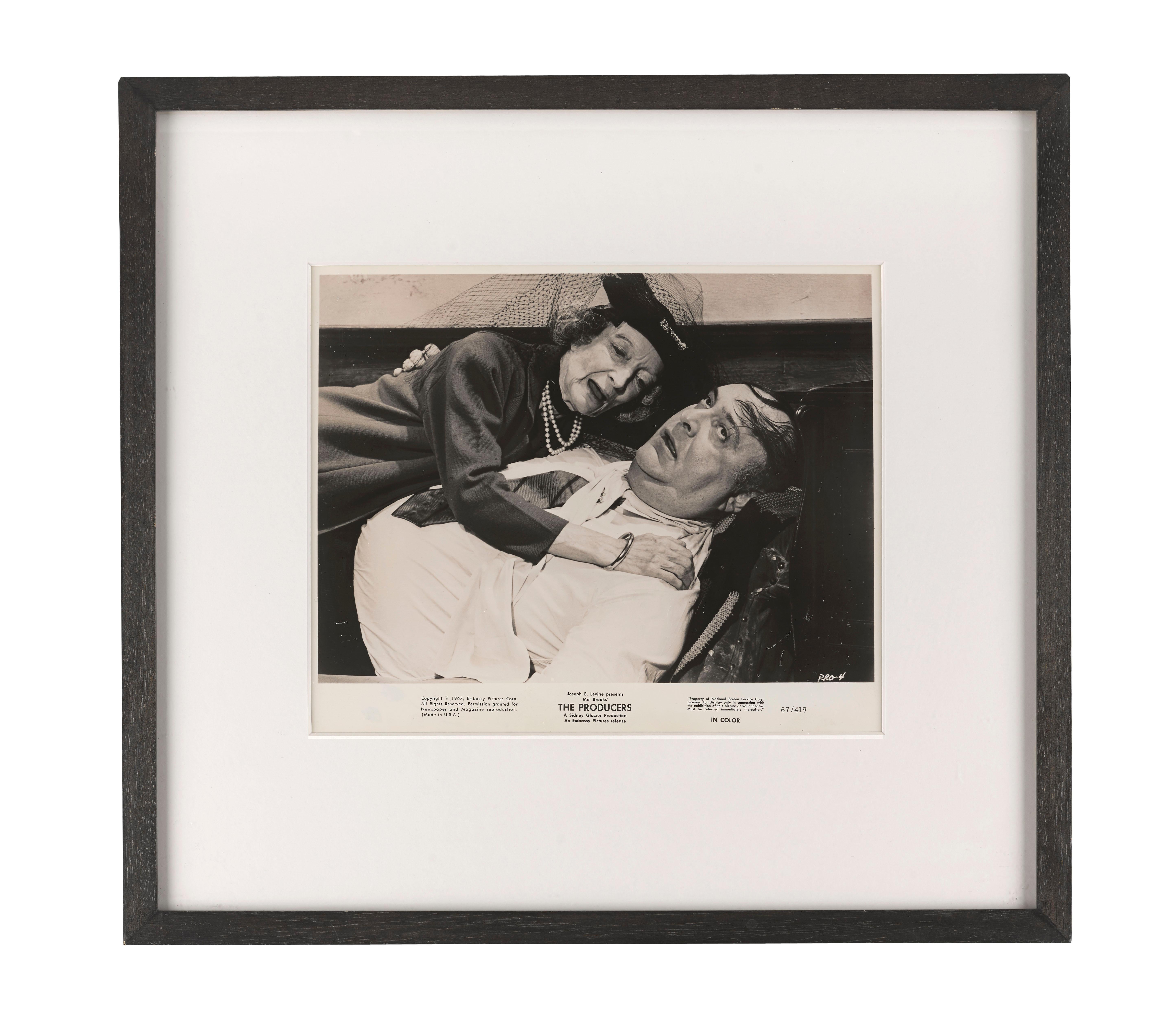 Original American photographic production still from the classic 1967 comedy directed by Mel Brooks and starring Zero Mostel and Gene Wilder.
Max Bialystock is launching himself into little old lady land. Hold me, Touch me.
The piece is conservation