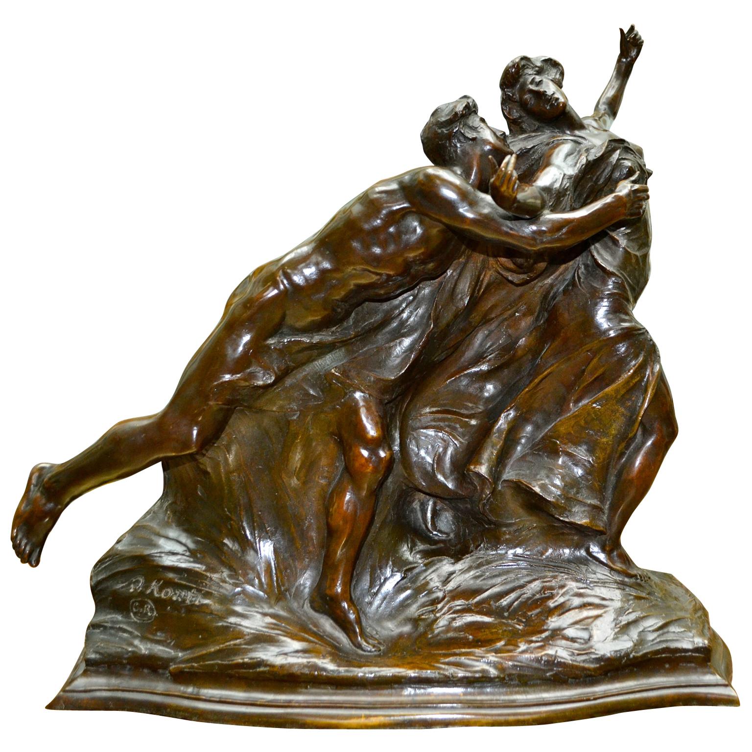 An allegory of “The Pursuit of Happiness” A wonderful ‘fluid’ bronze statue depicting a nude young man pursuing a classically draped woman, her long robes flowing in the wind, reminiscent of the style of Rodin; the bronze with dark brown patina is