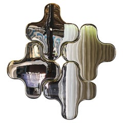 The Puzzle Mirror, a captivating modern masterpiece made of glass and Titanium