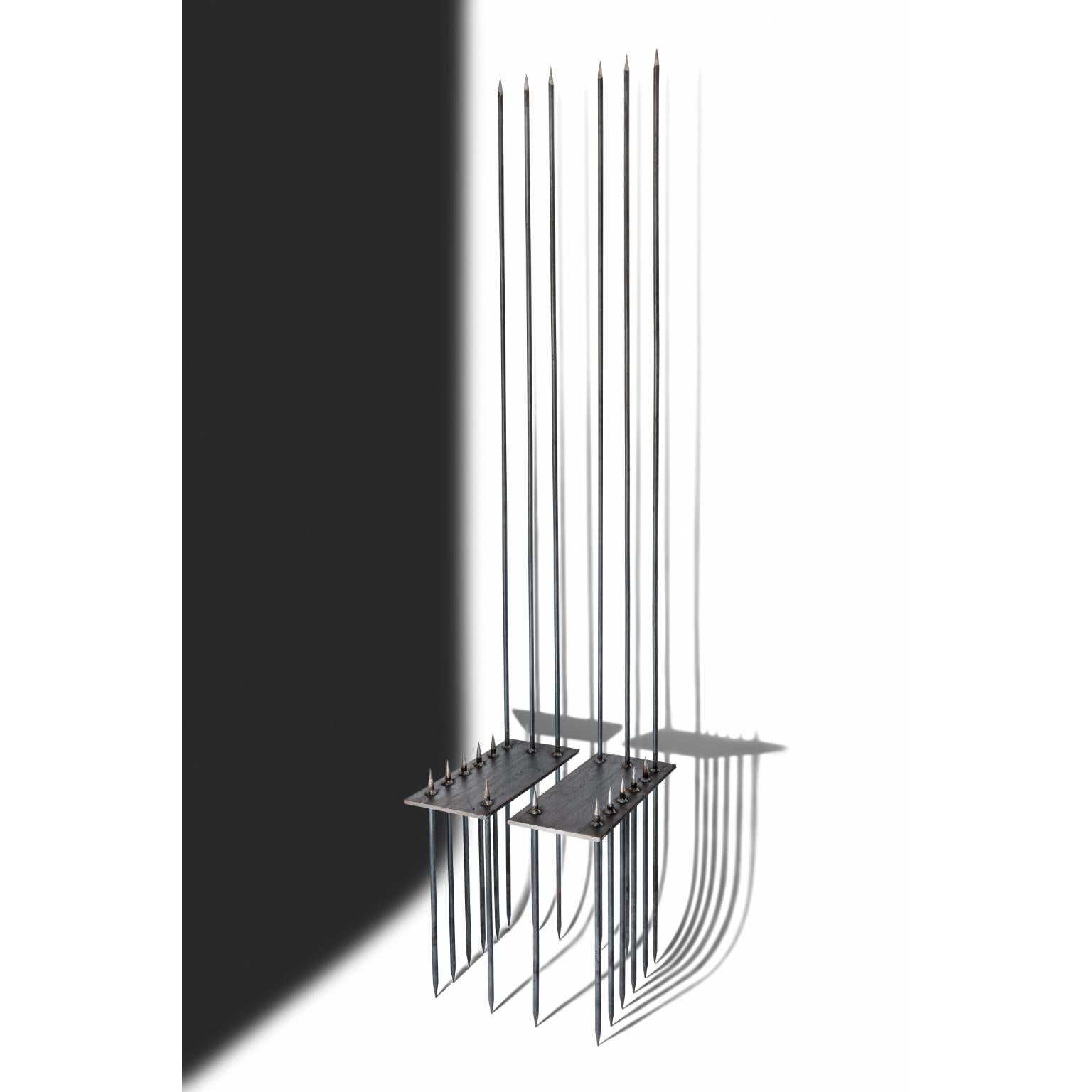 The Queen’s Chair by Alina Alamorean
One Of A Kind.
Dimensions: D 45 x W 40 x H 200 cm. SH: 46,5 cm.
Materials: Steel.

The dimensions for a single chair are D 45 x W 20 x H 200 cm. SH: 46,5 cm. This chair can also be used as a side table. Skulls