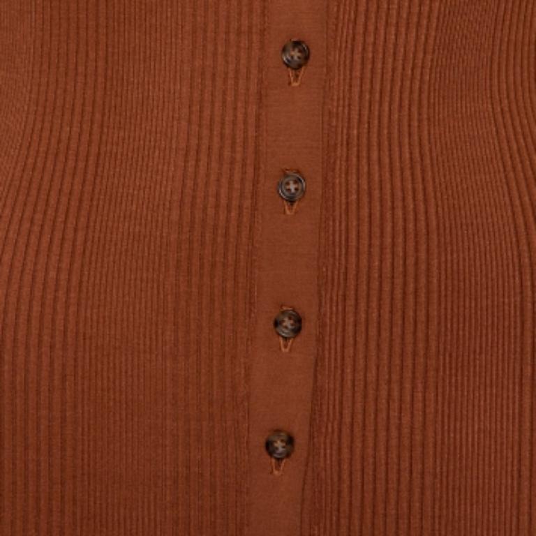 The simple design of this The Range dress stands out. Made with fine quality fabric, this piece is all about adding some style and finesse. It features long sleeves, a V-neck, and a subtle ribbed pattern all over, button fastenings at the front.