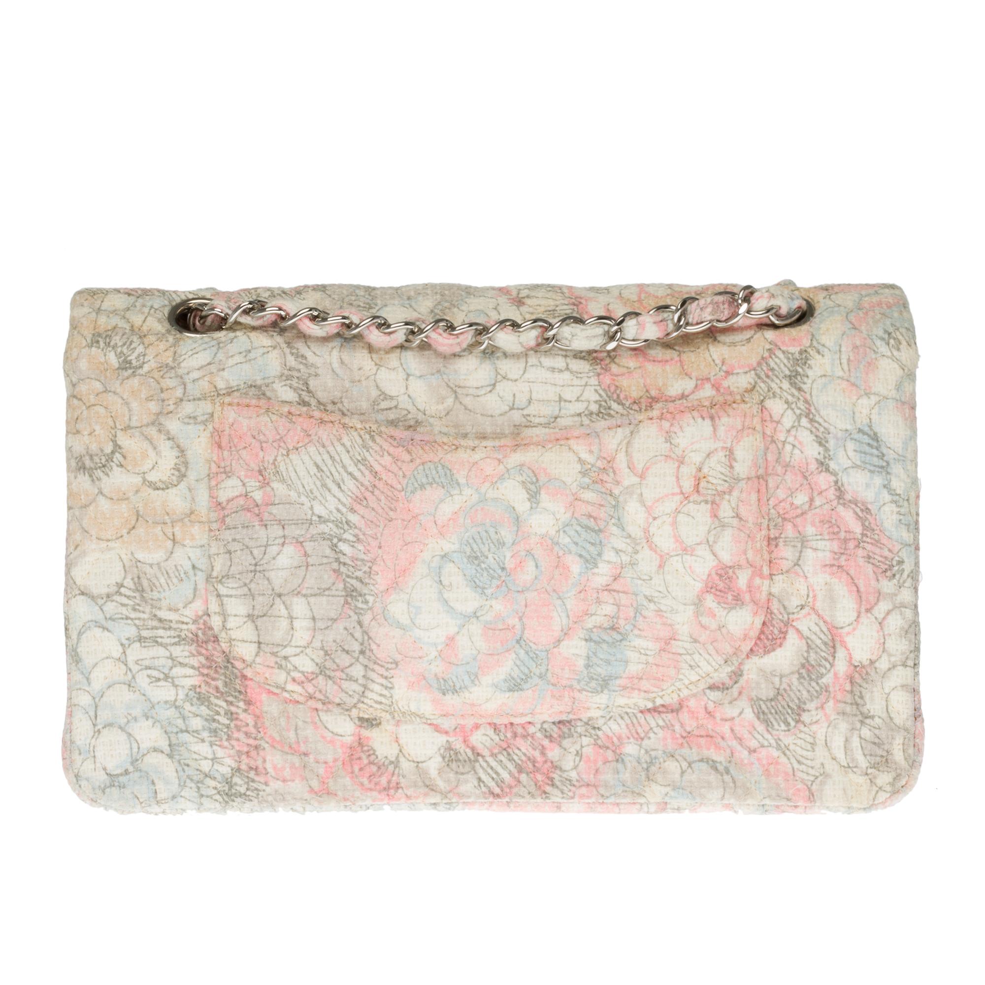 VERY RARE & COVETED!

Timeless bag out of Tweed Camellia pink, grey and ivory partially quilted , silver metal hardware, silver metal handle intertwined with pink tweed, grey and ivory allowing a hand or shoulder.
Padded flap closure, silver metal