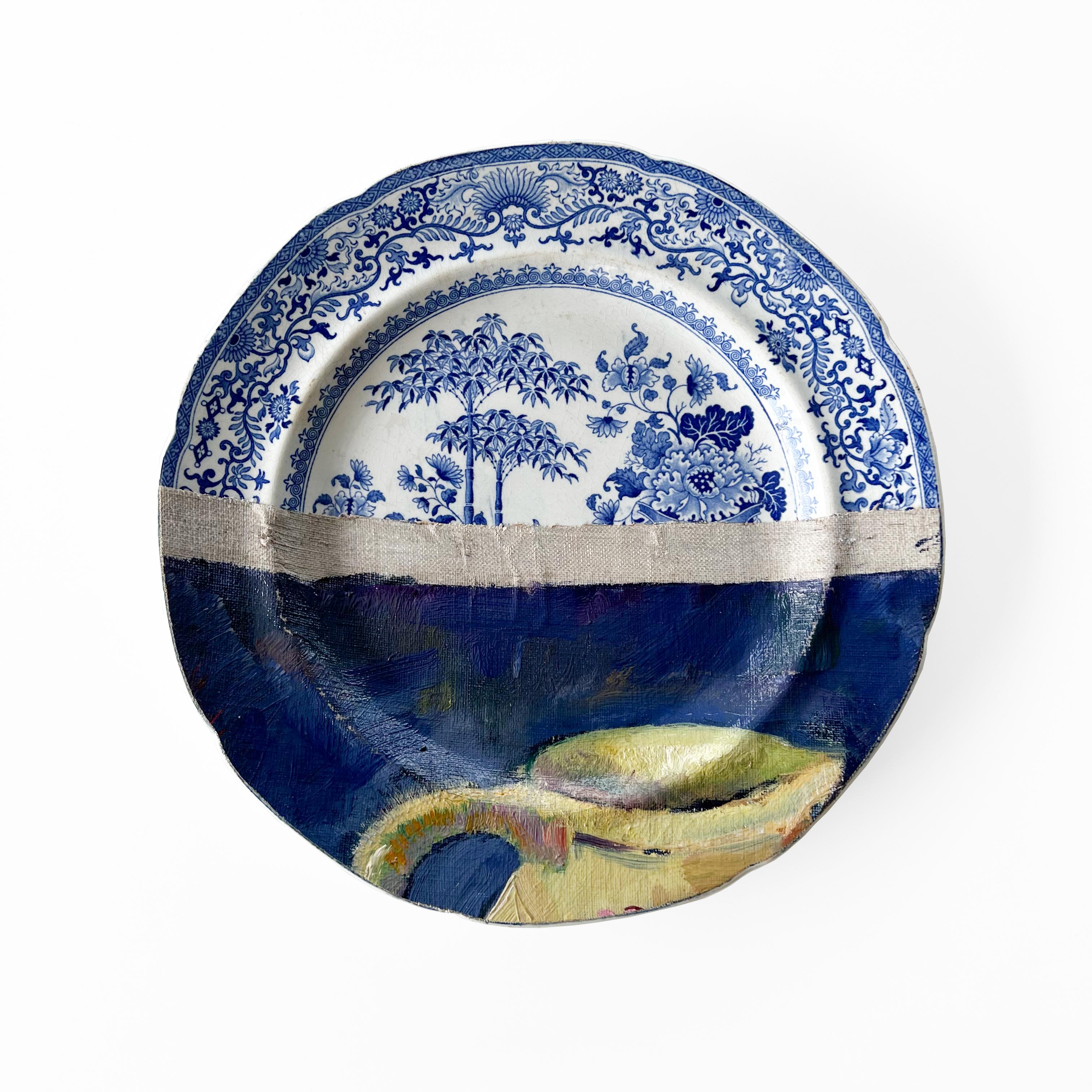 “The Red Necklace” includes two 19th C. Blue & White plates (one is British and one is French) and a big late 19th C. hand painted Chinese plate.
The painting features a still life with a red necklace on a light blue plate, with a yellow ceramic