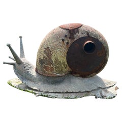 “The Reims Snail” by Alfred Lefebvre (1845–1916), a enameled cast iron stove