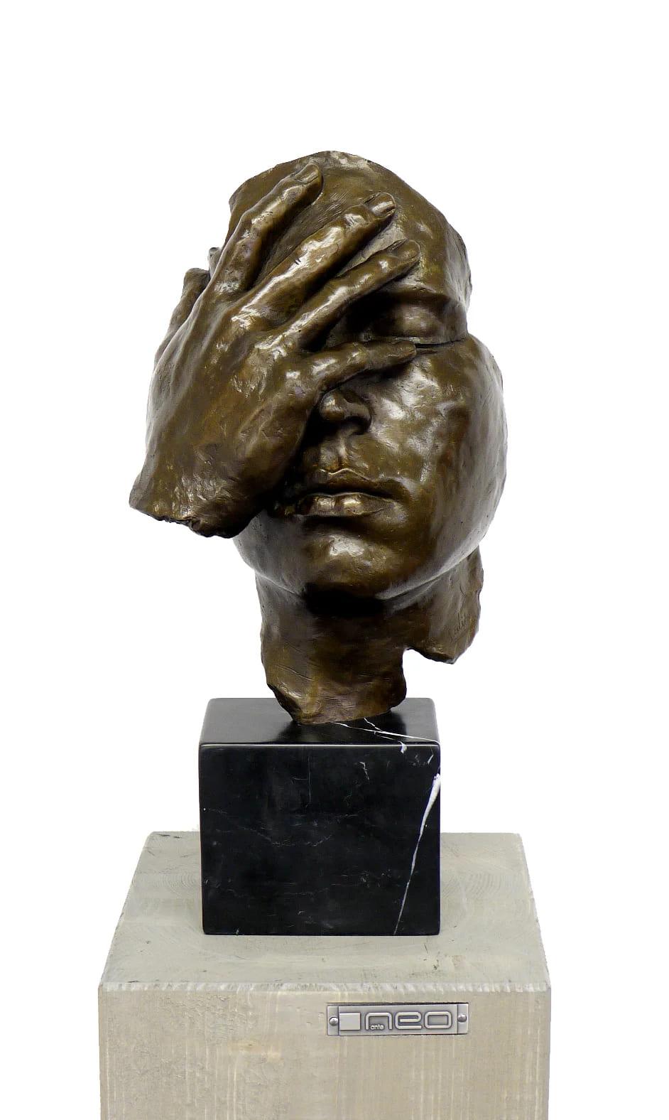 Bronze sculpture The Resignation inspired by Salvador Dalí, depicting a human head with a hand covering the face, symbolizing withdrawal, silence, and inward reflection. Cast in patinated bronze and mounted on a black marble base, this piece