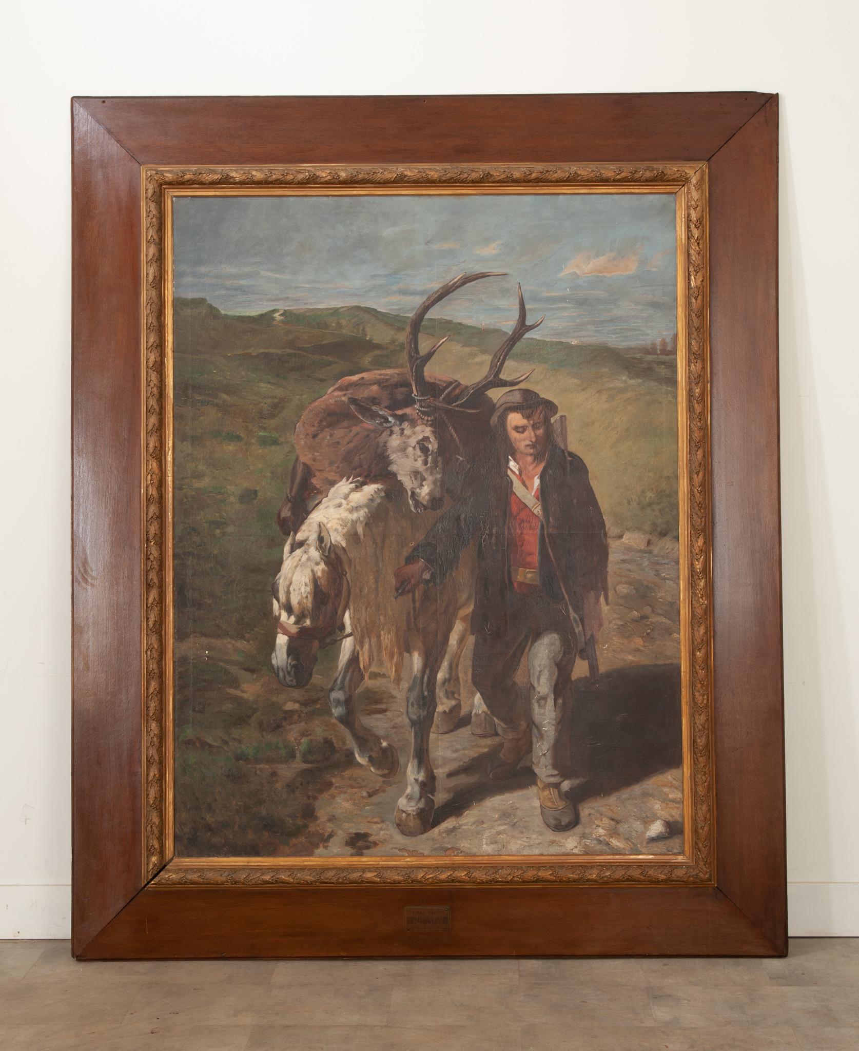 A massive gilt and mahogany frame houses this wonderful original oil on canvas depiction of a hunter returning from the hunt, with his taken stag being carried on horseback. With a somewhat exhausted look, the hunted, the hunter, and his horse