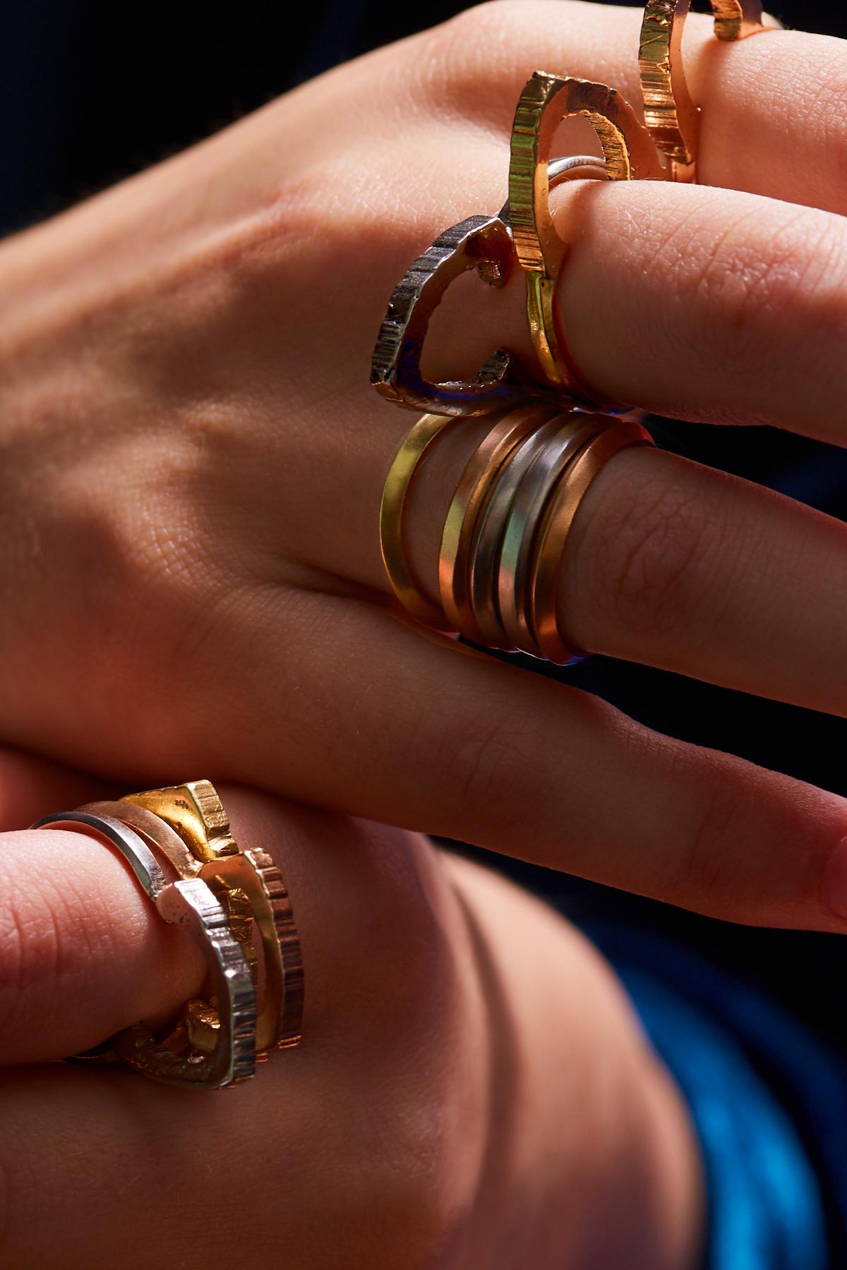 The Rock Hound have based a set of stacking rings around their instantly recognisable logo and handmade them in three tones of sumptuous 18 Carat Fairtrade Gold. This style is inverted with a knife-edge running around the outer rim.

Would make the