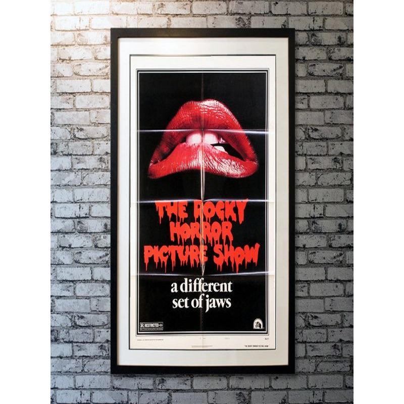The Rocky Horror Picture Show, Unframed Poster, 1975

Original US 1 Sheet (27 X 41 Inches). In this cult classic, sweethearts Brad (Barry Bostwick) and Janet (Susan Sarandon), stuck with a flat tire during a storm, discover the eerie mansion of