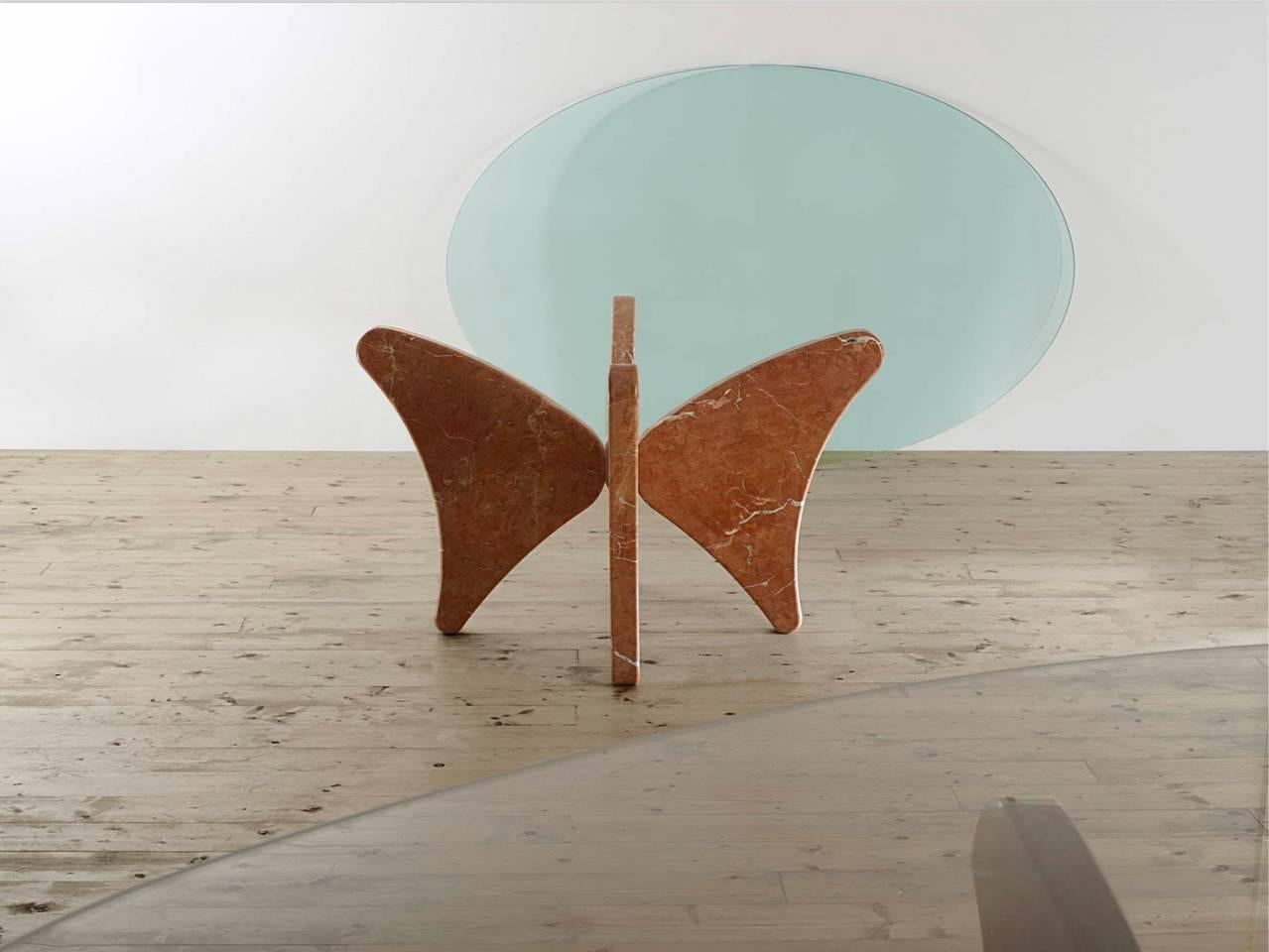  The Rosso Alicante table was created by Bruno Vaerini an Italian Architect/sculpturer in 2009. The table was inspired by the altarpiece of Piero Della Francesca placed in Brera. In the painting the red color comes from the marble in the background.