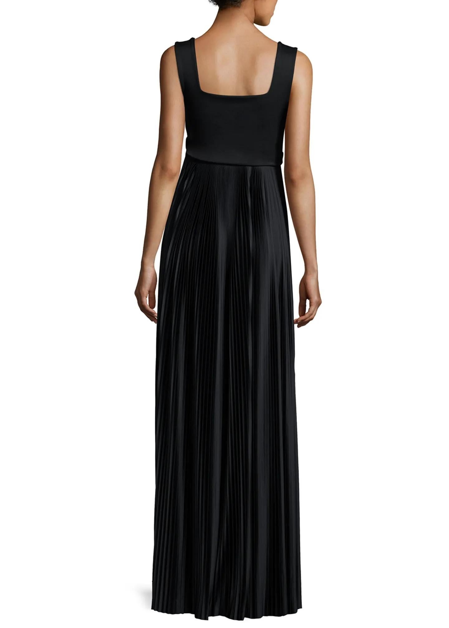 Introducing the epitome of sophistication and timeless elegance: The Row Alain Black Dress in size XS. Crafted to perfection and brand new with tags, this exquisite gown exudes understated luxury from every seam.

The gown features a soft-sheen