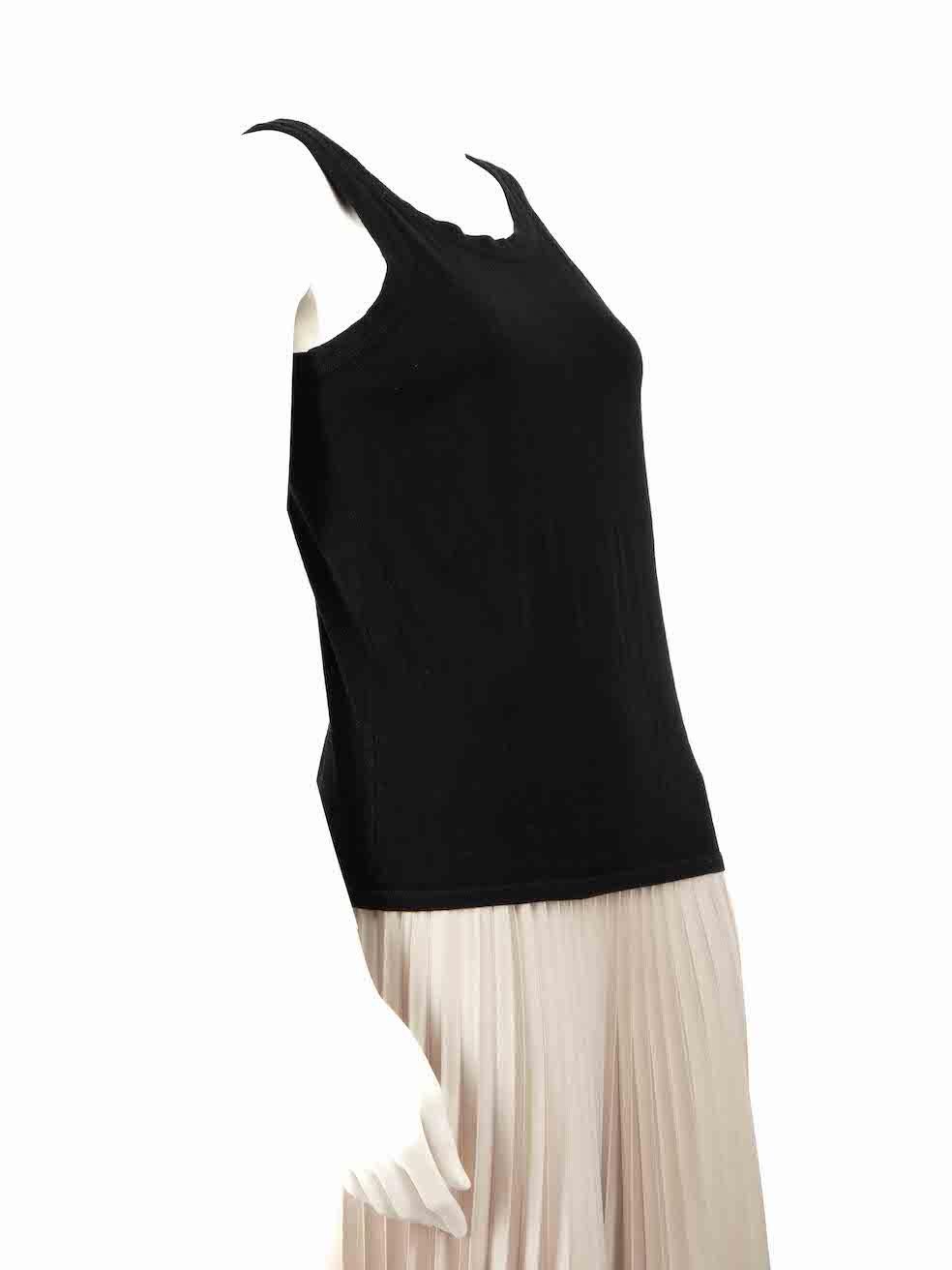 CONDITION is Very good. Hardly any wear to tank top is evident on this used The Row designer resale item.
 
 
 
 Details
 
 
 Black
 
 Cotton
 
 Tank top
 
 Round neckline
 
 Stretchy
 
 Sleeveless
 
 
 
 
 
 Made in USA
 
 
 
 Composition
 
 95%