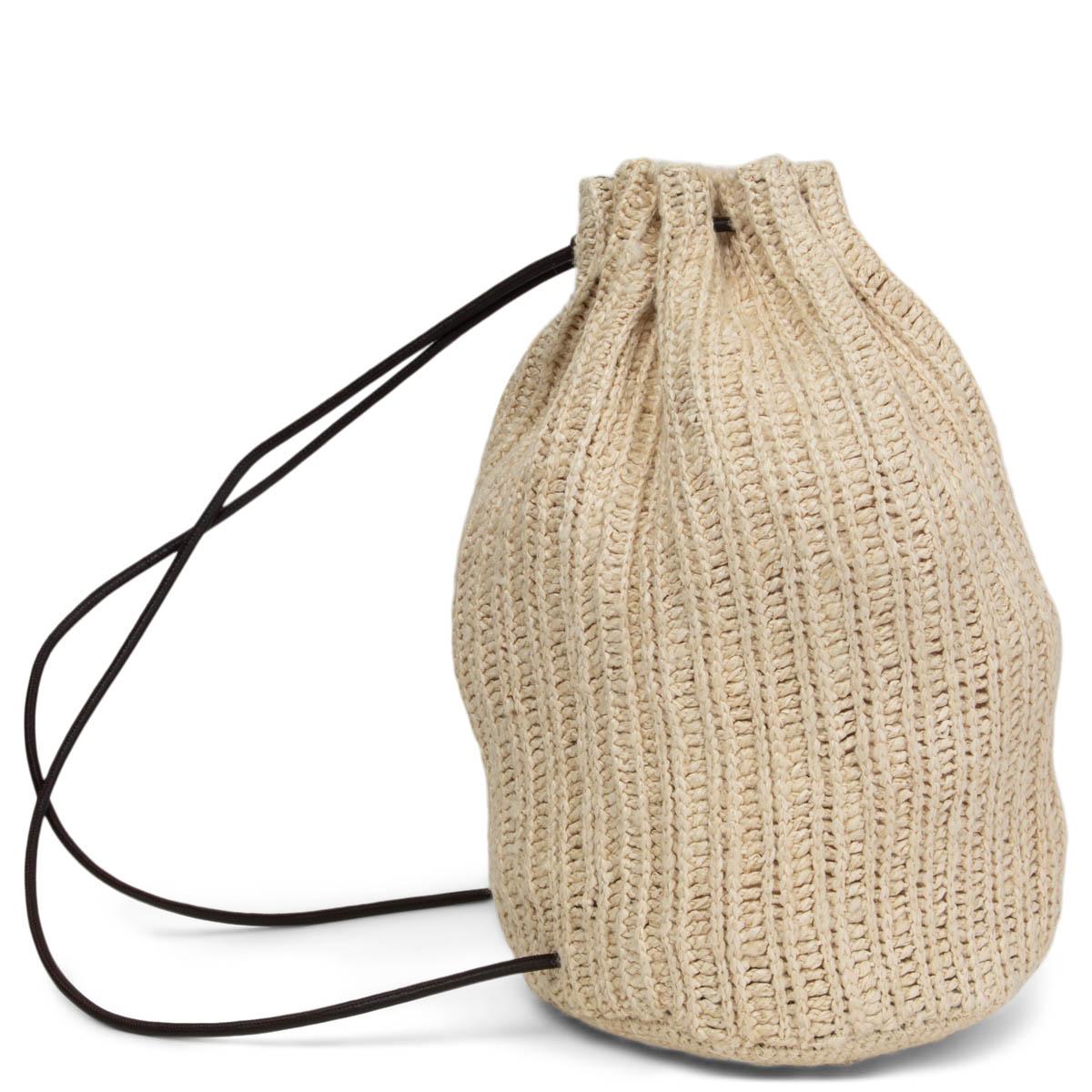 100% authentic The Row 'Massimo' backpack in off-white silk-blend raffia featuring espresso brown leather trimming. Bucket silhouette with drawstring leather straps closure. Unlined. Has been carried and is in excellent condition.
