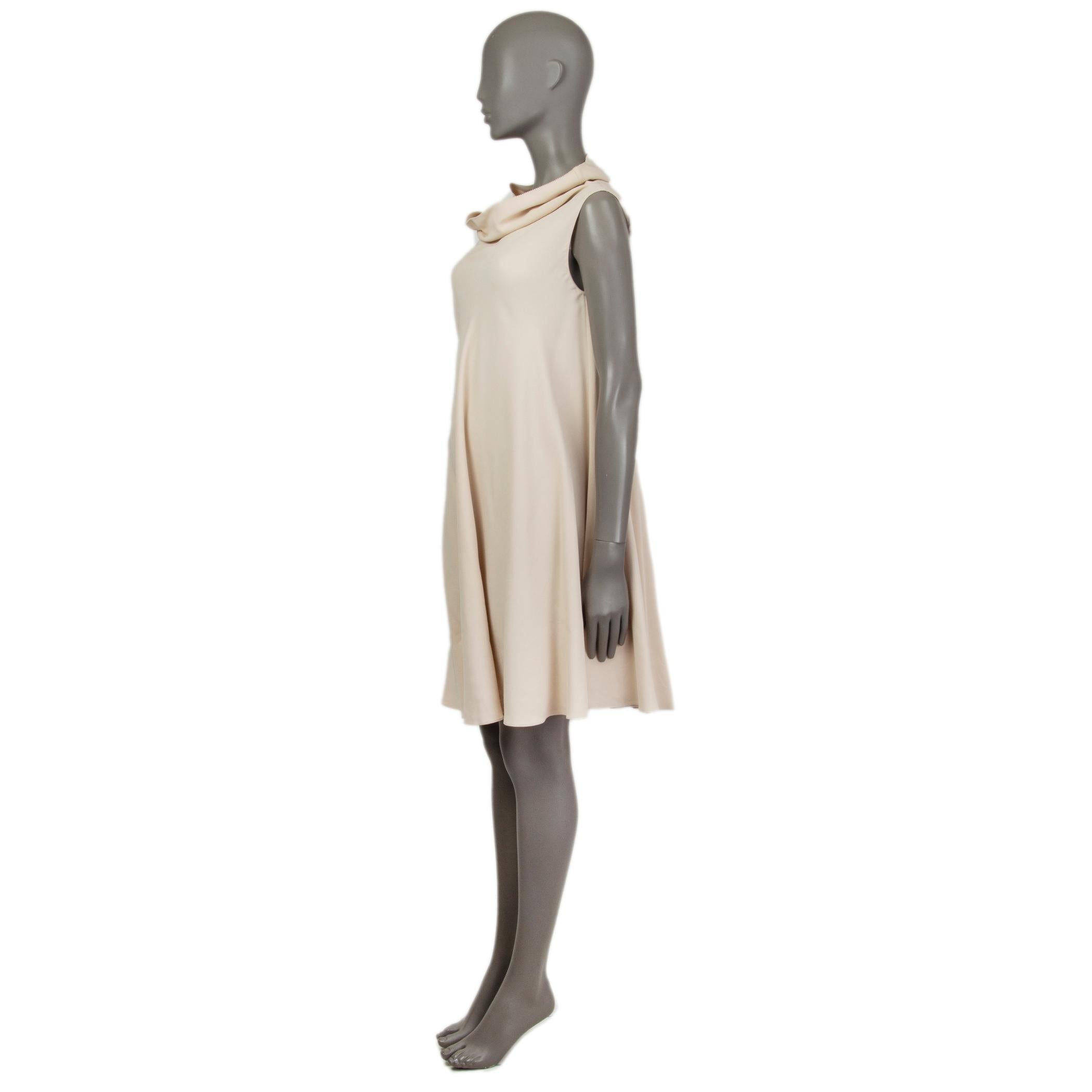 The Row tent dress in light beige viscose (95%) and elastane (5%). With cowl neck and two slit pockets on the sides. Unlined. Has been worn and is in excellent condition. 

Tag Size S
Size S
Bust 100cm (39in) to 116cm (45.2in)
Waist 140cm (54.6in)