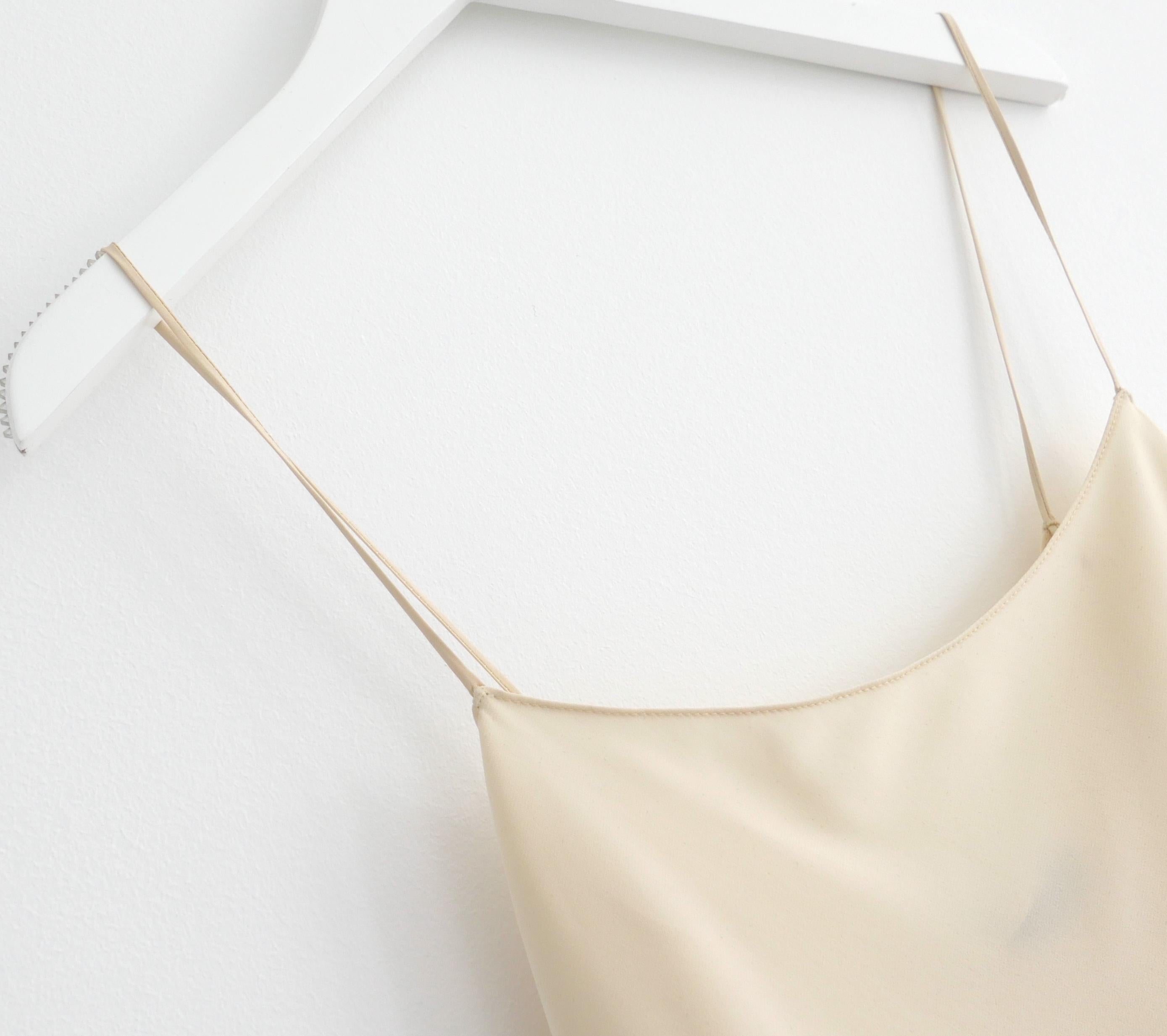 Ultra luxe The Row Biggins silk camisole vest top. New with tags. Made from ultra light and soft cream matte silk. Size S with a loose fit. Measures approx - bust 32” and length 23”
