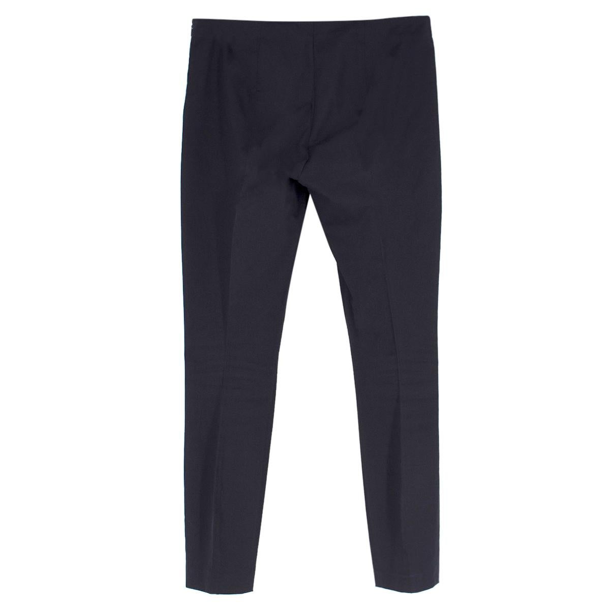 The Row Black Cigarette Trousers

-Black skinny cigarette trousers
-Classic central seam 
-Side zip closure

Please note, these items are pre-owned and may show signs of being stored even when unworn and unused. This is reflected within the