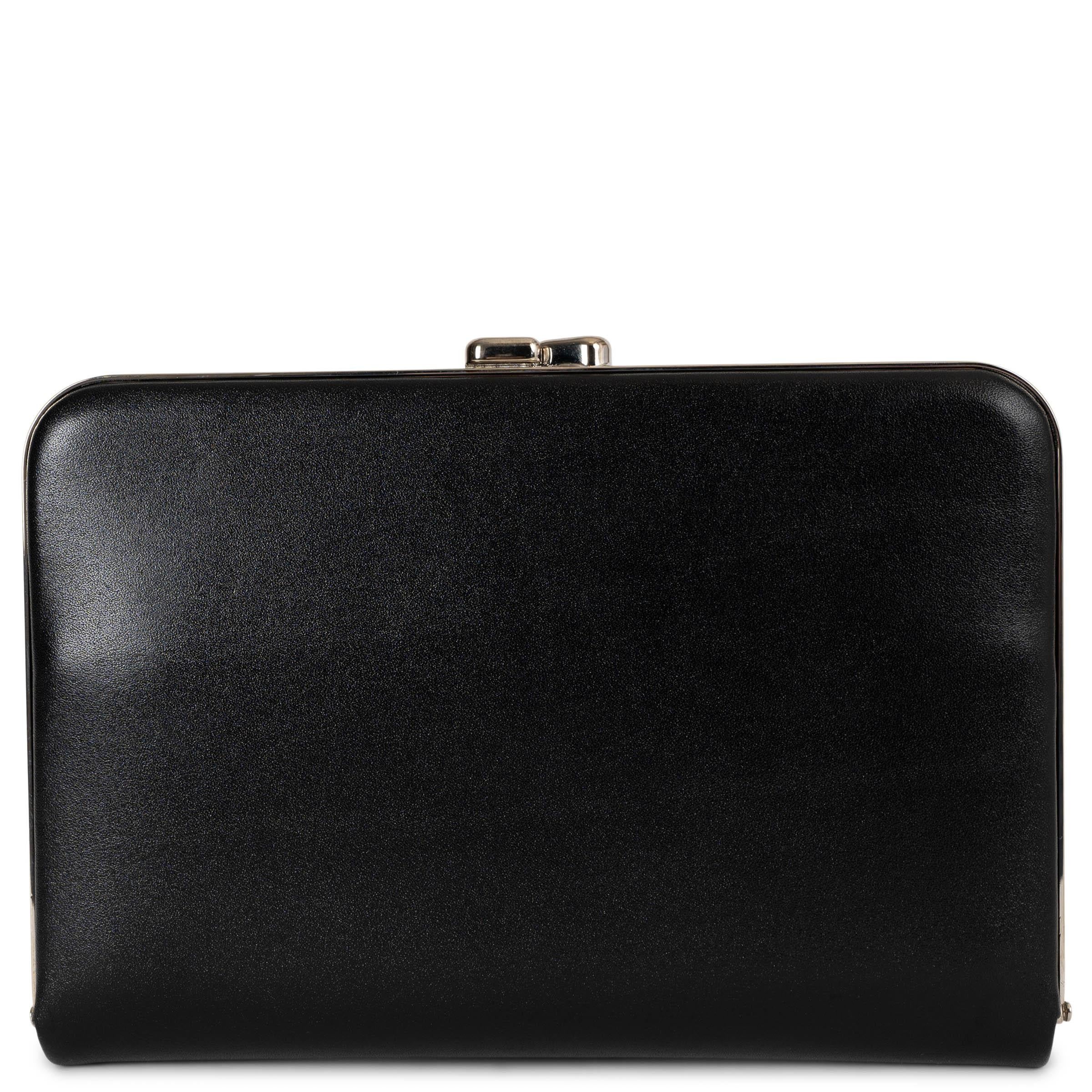 This 100% authentic The Row Minaudiere clutch in black leather with a silver-tone frame exudes refined minimalism. Designed with a structured silhouette, it closes securely with a kiss-lock on top and is lined in leather for a luxurious touch. The