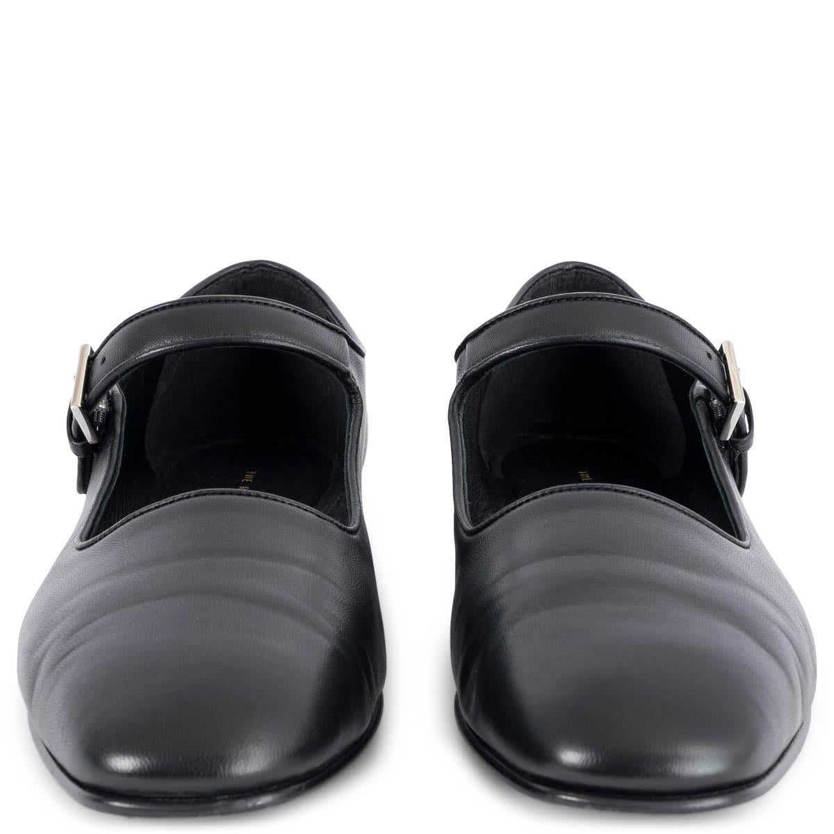 This 100% authentic The Row Ava Mary-Jane flats in black smooth calfskin embody understated elegance and timeless craftsmanship. Featuring a classic silhouette with a refined silver-tone buckle closure, they offer a sleek, minimalist aesthetic. A