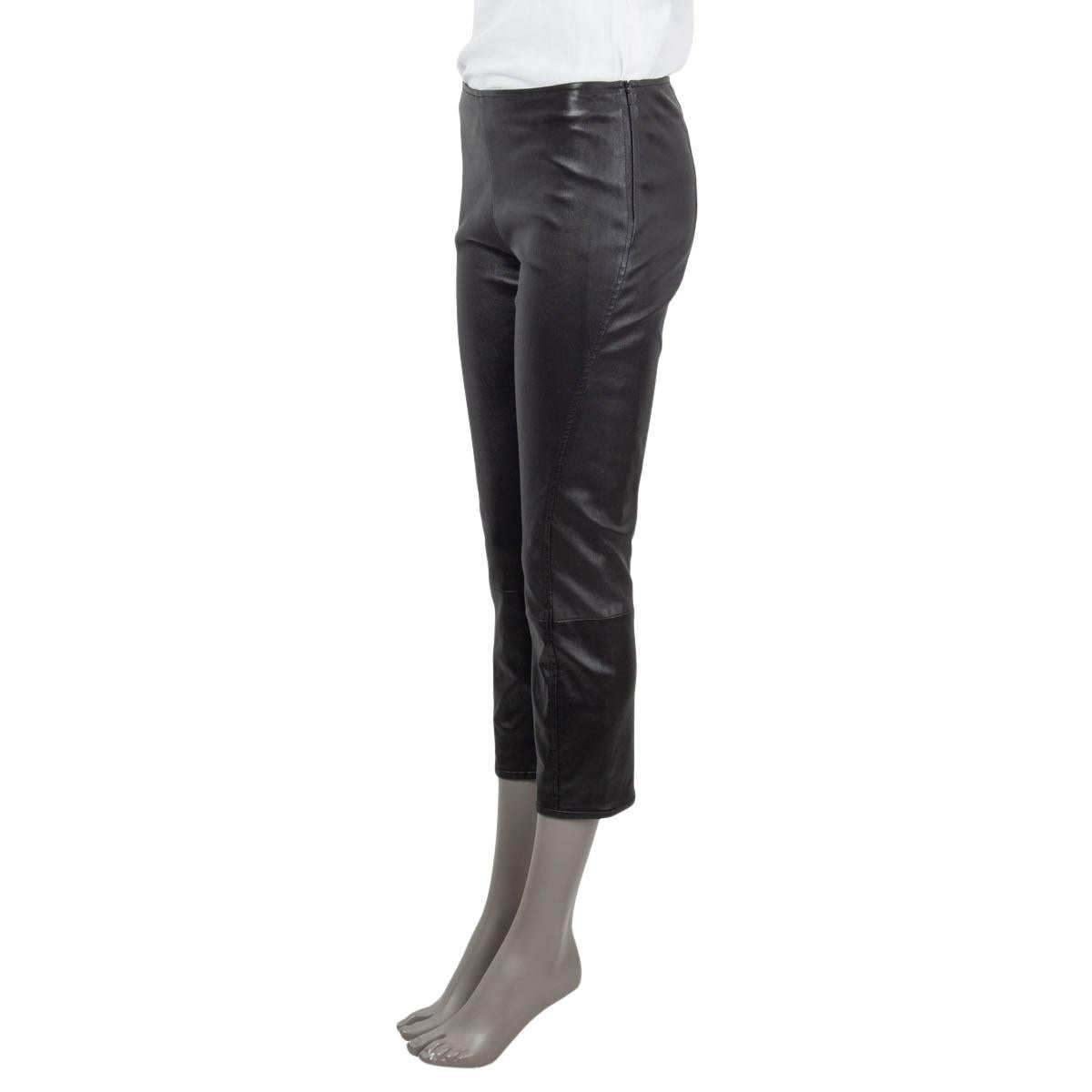 100% authentic The Row Capri pants in shiny black lambskin leather (100%). Lined in black silk (93%) and elastane (7%) and bonded with cotton (97%) and elastane (3%). Opens with a zipper on the left side and is stretchy with a slim fit. Has been