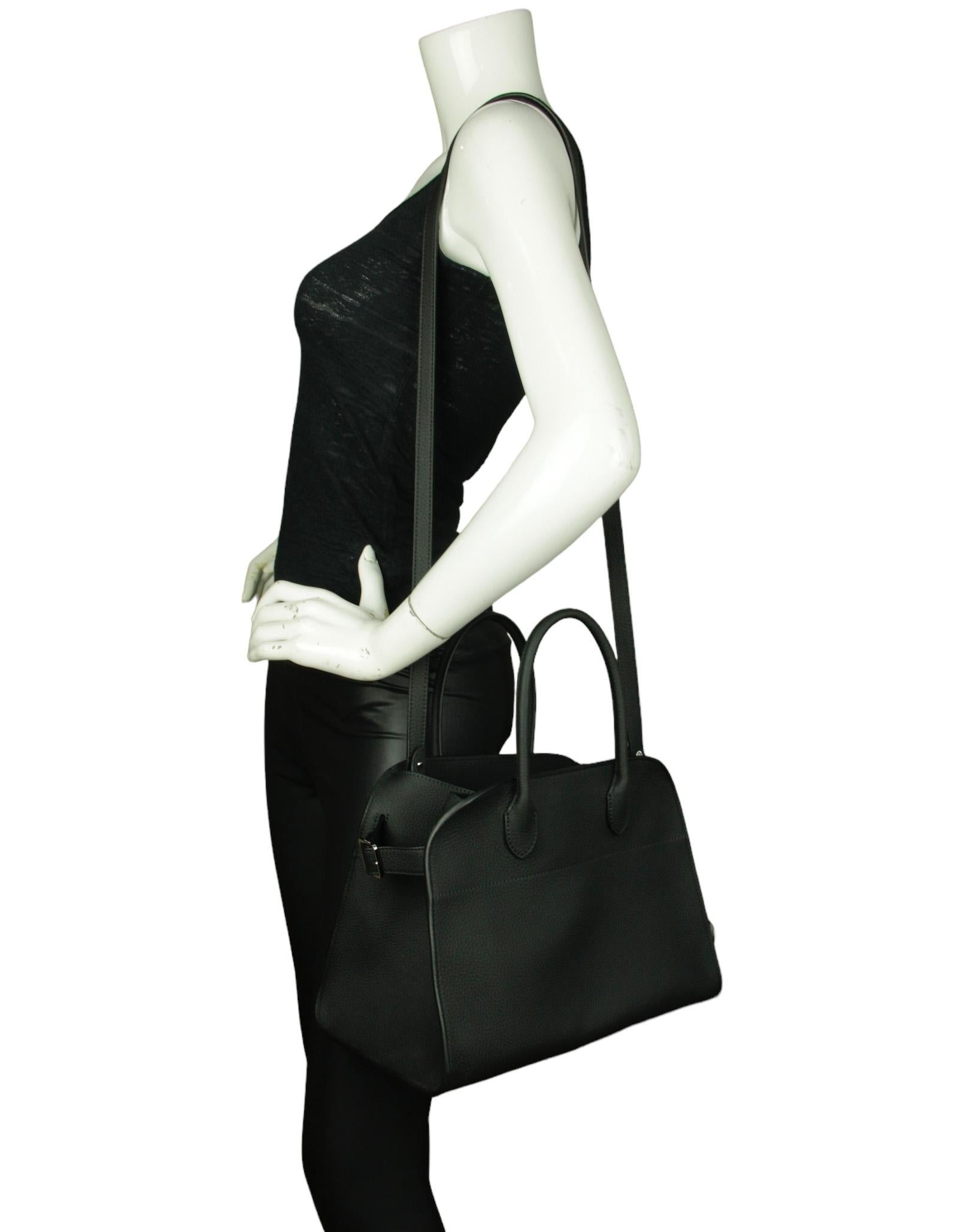 Made In: Italy
Color: Black 
Hardware: Silvertone
Materials: Leather
Lining: Canvas
Closure/Opening: Open
Exterior Pockets: None
Interior Pockets:  One zip pocket,two flat 
Exterior Condition: Like new
Interior Condition: Like new
Includes: Dustbag,