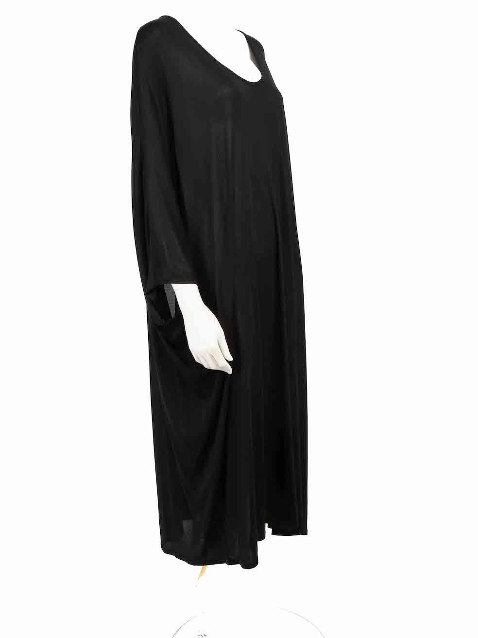 CONDITION is Very good. Hardly any visible wear to dress is evident on this used The Row designer resale item.
 
 Details
 Black
 Viscose
 Dress
 Short batwing sleeves
 Midi
 Round neck
 Stretchy
 Oversized fit
 
 
 Made in USA
 
 Composition
 85%