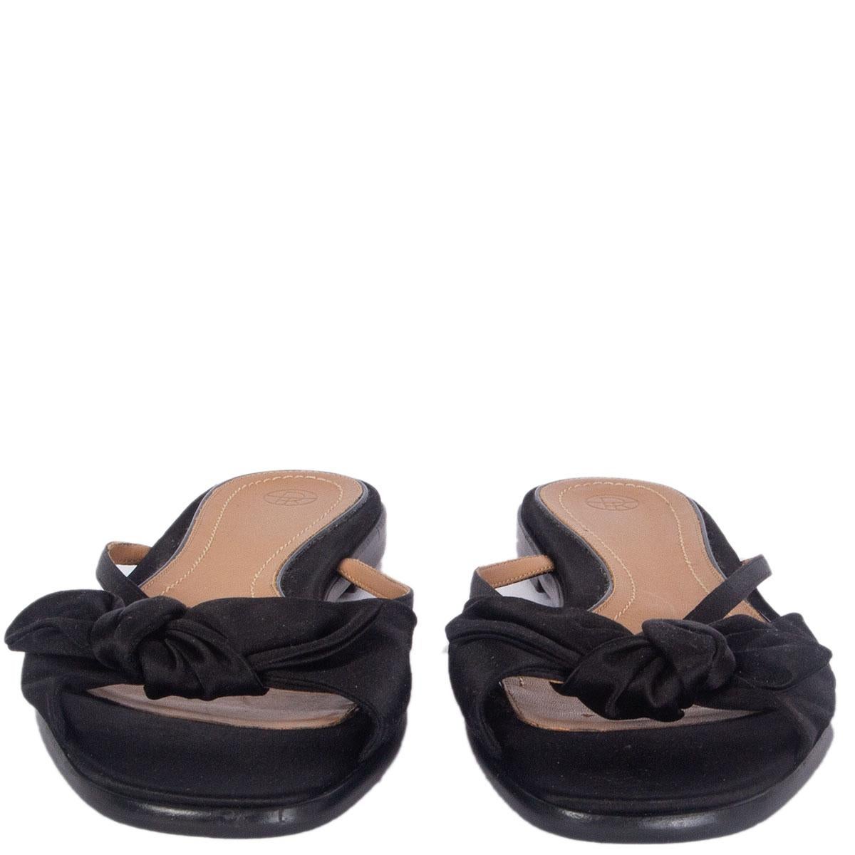 100% authentic The Row April bow slides in black satin. Have been worn and are in excellent condition. 

Imprinted Size	40
Shoe Size	40
Inside Sole	26cm (10.1in)
Width	8cm (3.1in)
Heel	1cm (0.4in)
All our listings include only the listed item unless
