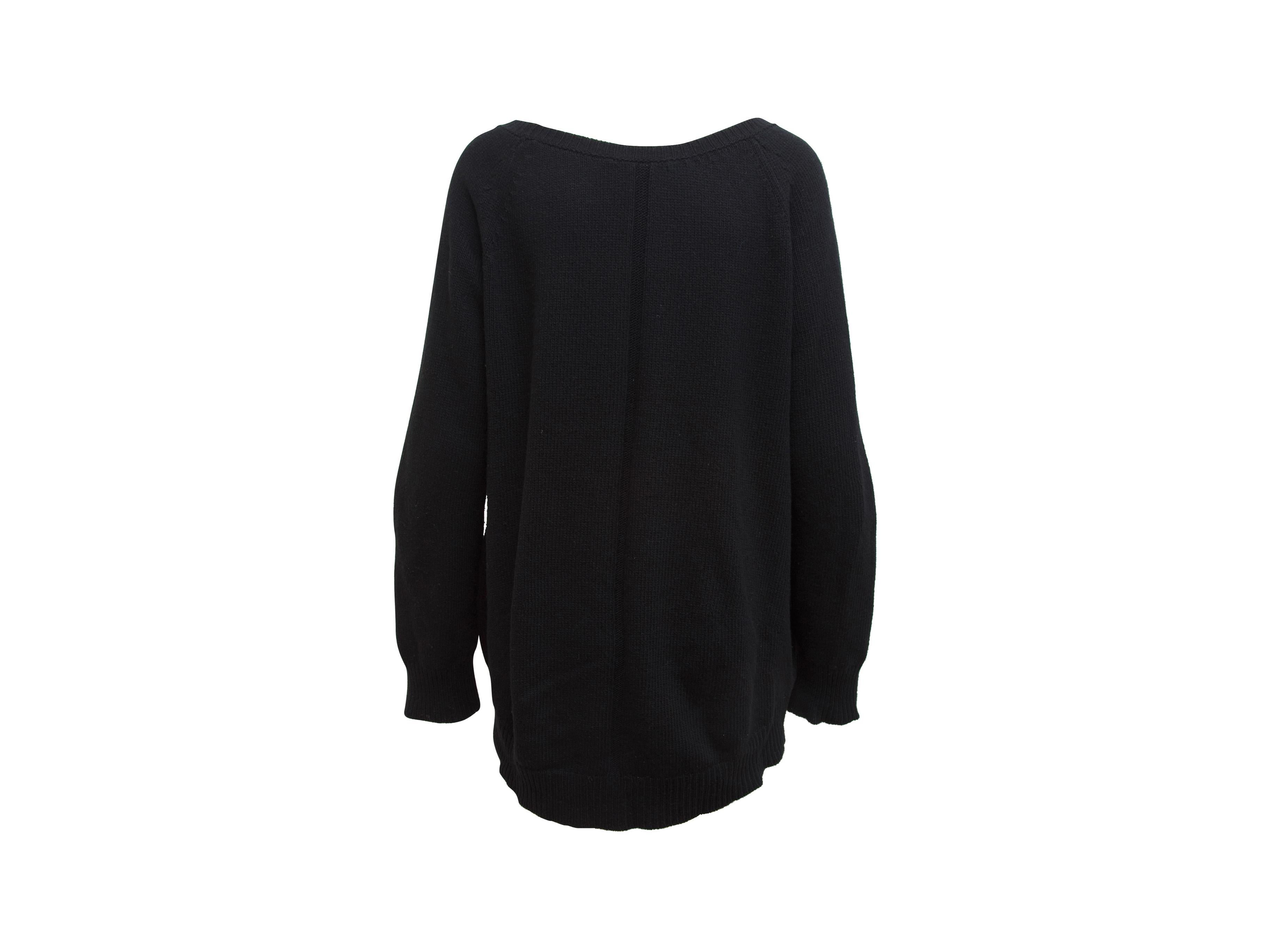 Product details: Black The Row Scoop Neck Sweater. This long sleeve sweater from The Row has ribbed cuffs and hem. 42