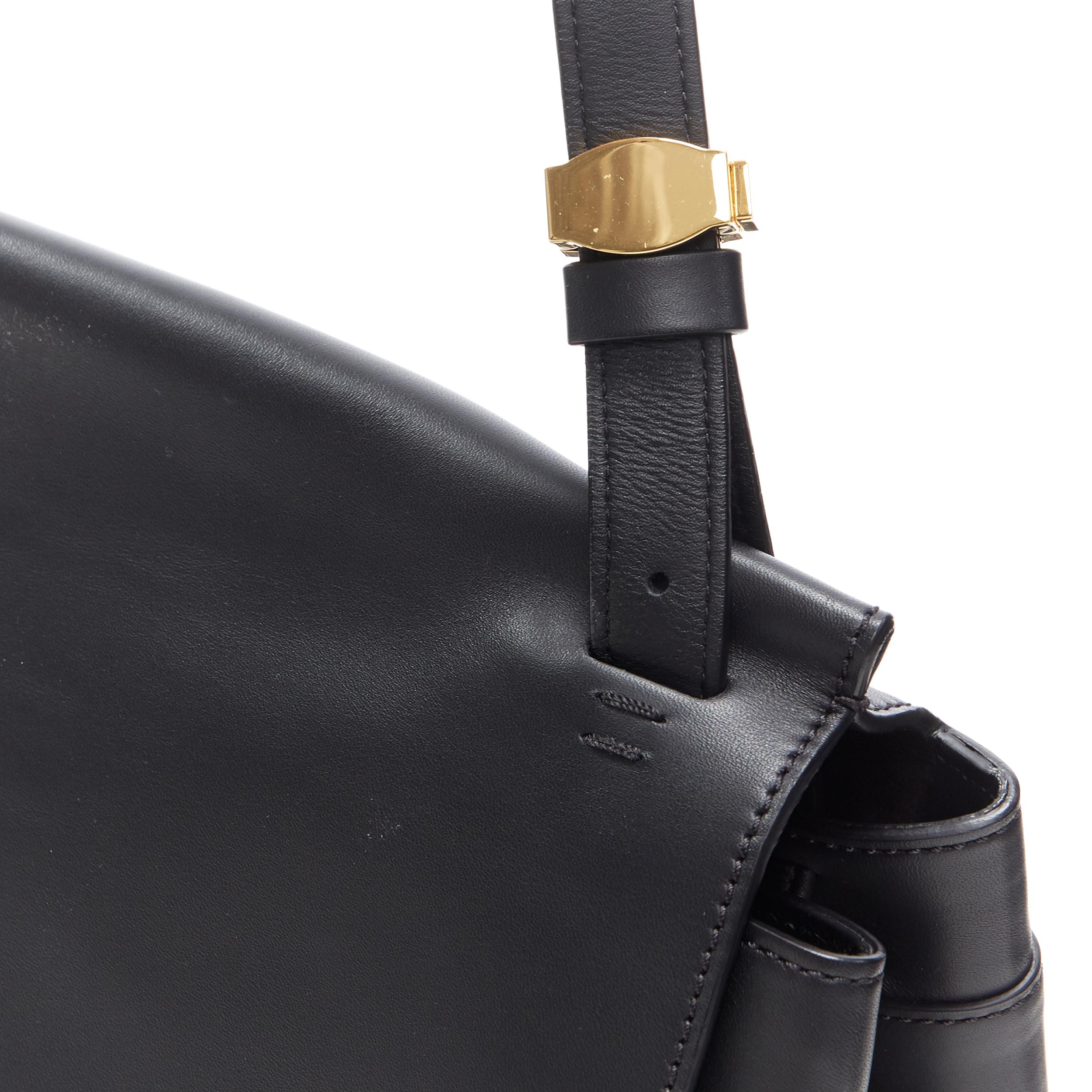 THE ROW black smooth leather minimalist flap front gold buckle shoulder bag In Excellent Condition In Hong Kong, NT