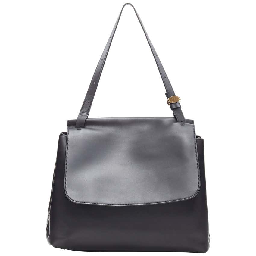 THE ROW Black Smooth Leather Minimalist Flap Front Gold Buckle Shoulder the-row-black-smooth-leather-minimalist-flap-front-gold-buckle-shoulder