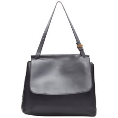 THE ROW black smooth leather minimalist flap front gold buckle shoulder bag