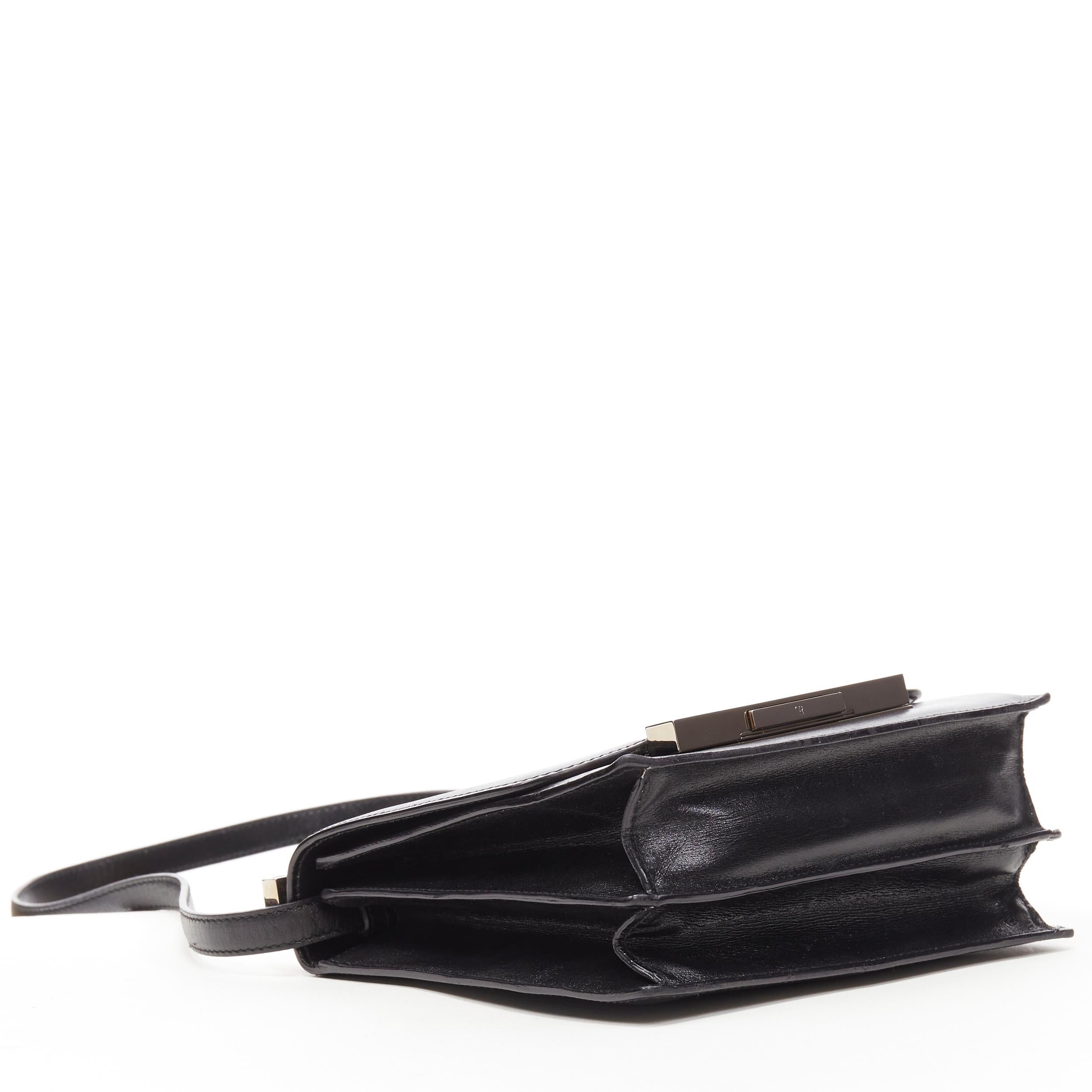THE ROW black smooth leather silver-tone hardware push lock flap shoulder bag In Fair Condition In Hong Kong, NT
