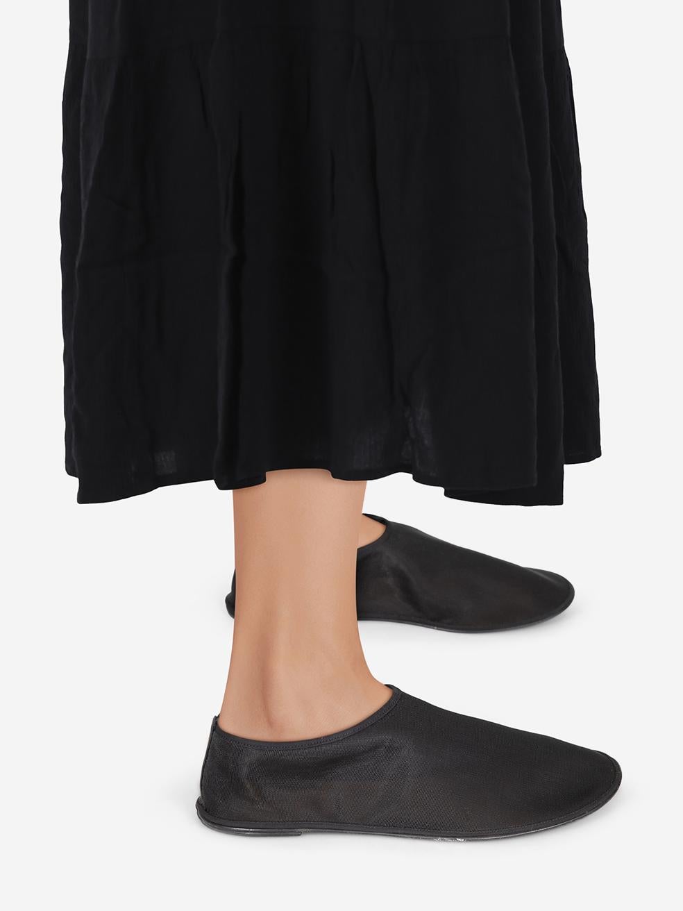CONDITION is Very Good. Hardly any visible wear to the shoes is evident on this used The Row designer resale item.
 

 Details
 

 

 Black
 

 Cloth textile
 

 Flat shoes
 

 Mesh
 

 See through
 

 Slip on
 

 Flat heel
 

 

 

 

 

 Made in